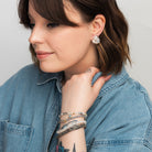 Elli Parr Knotted Stud in Silver on a model at Addison West