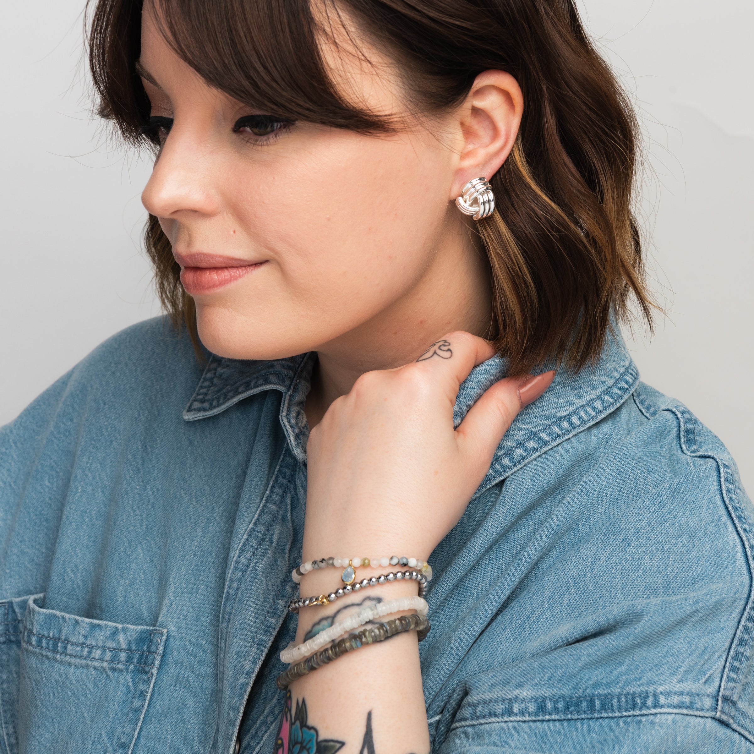 Elli Parr Knotted Stud in Silver on a model at Addison West