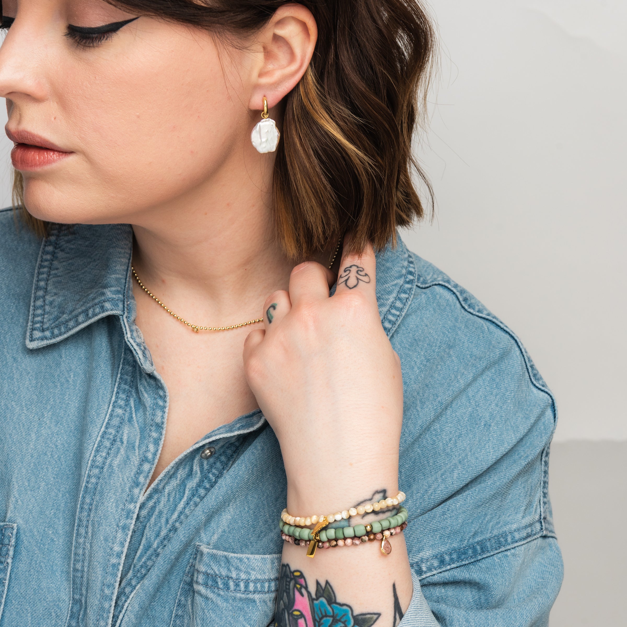 Elli Parr Freeform Pearl Hoops on a model at Addison West