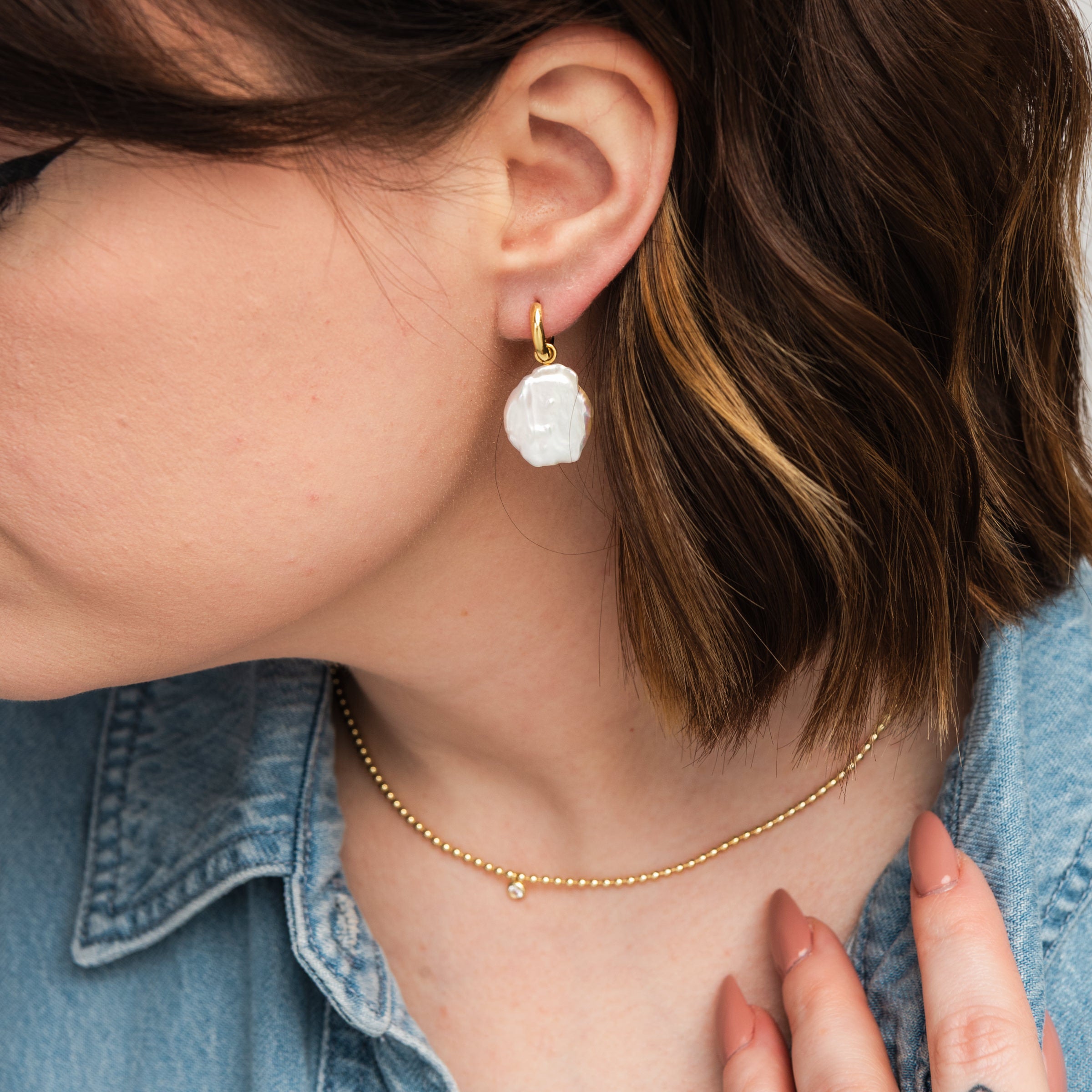 Elli Parr Freeform Pearl Hoops on a model at Addison West
