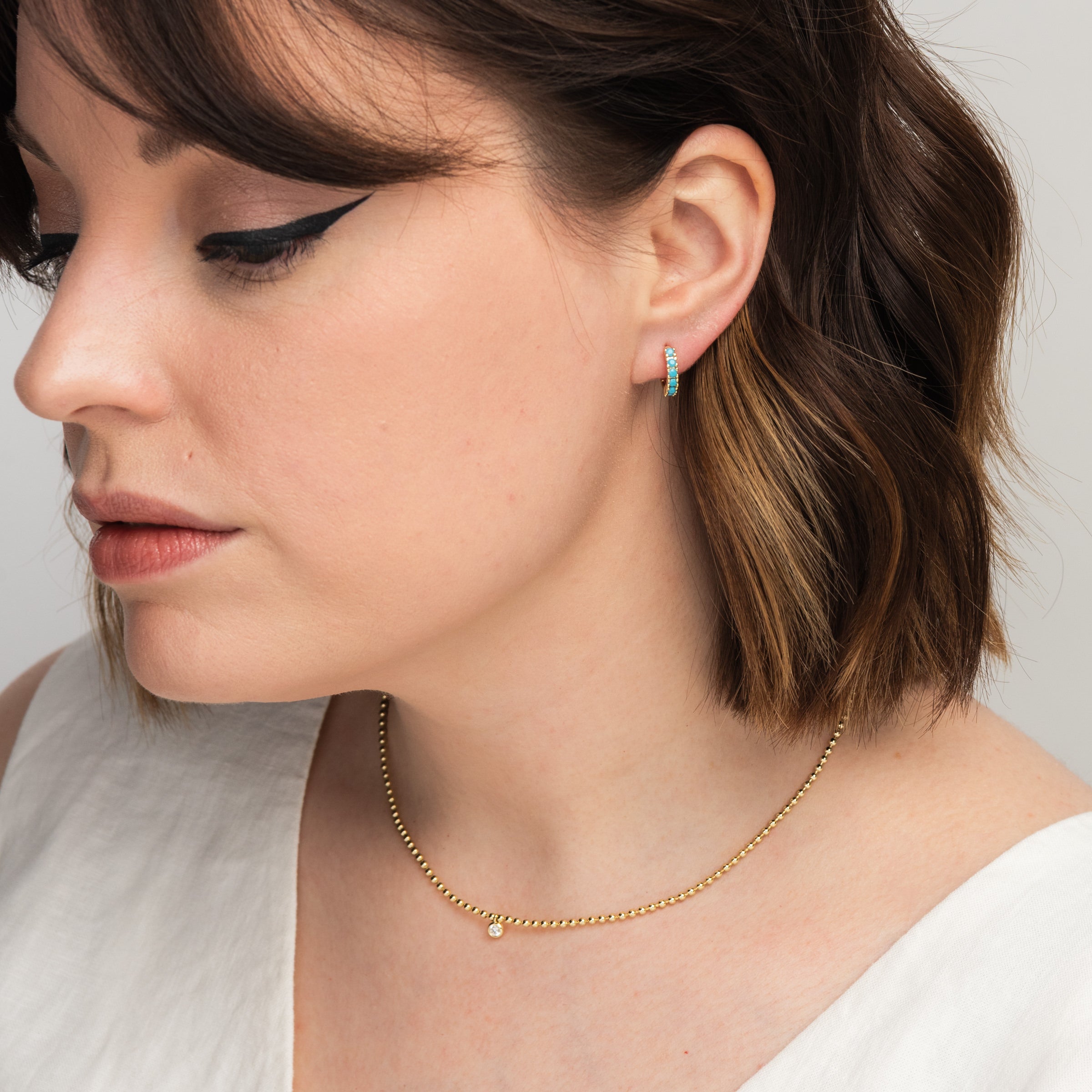 Juliette Gold Ball Necklace on a model at Addison West