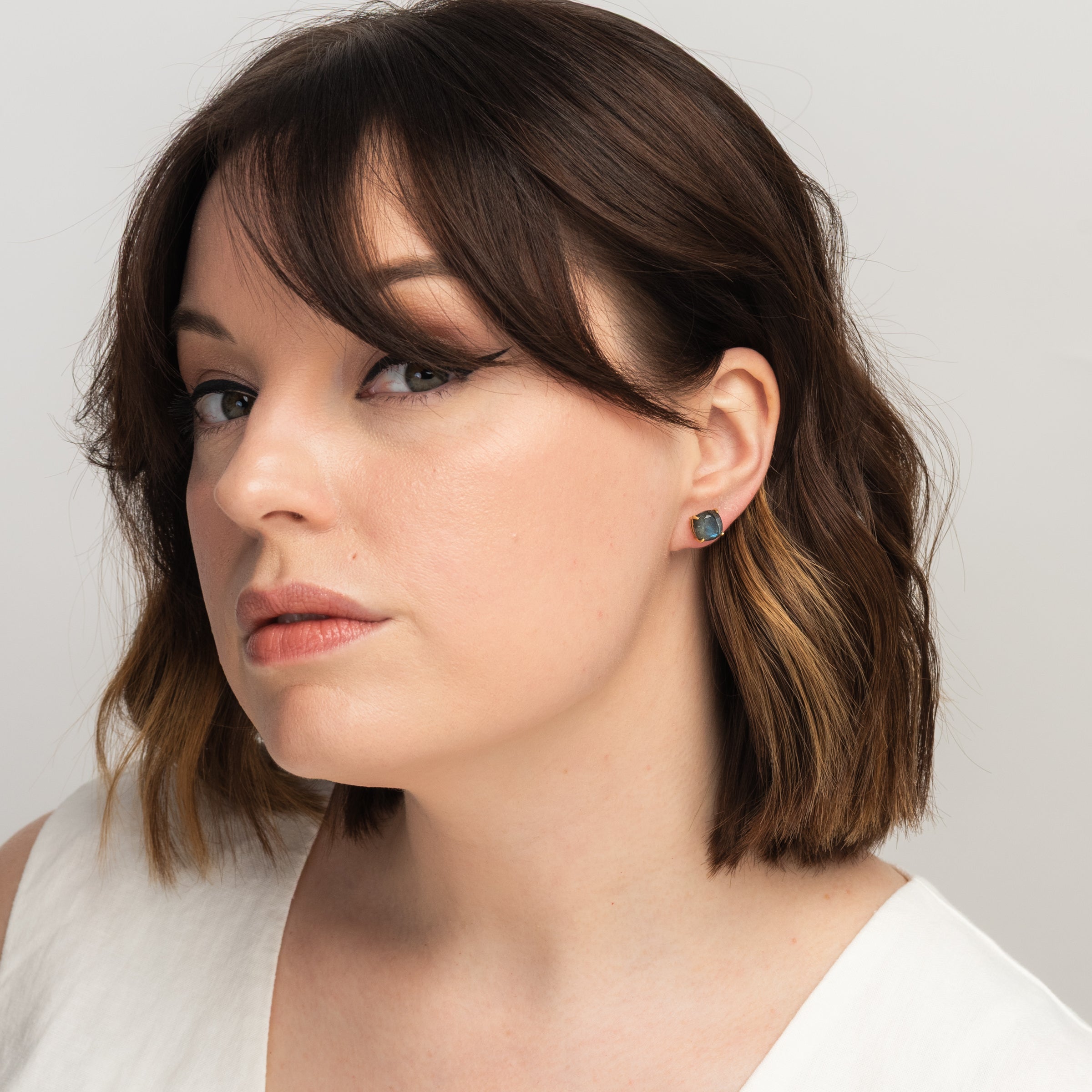 Emmy Studs in Labradorite on a model at Addison West