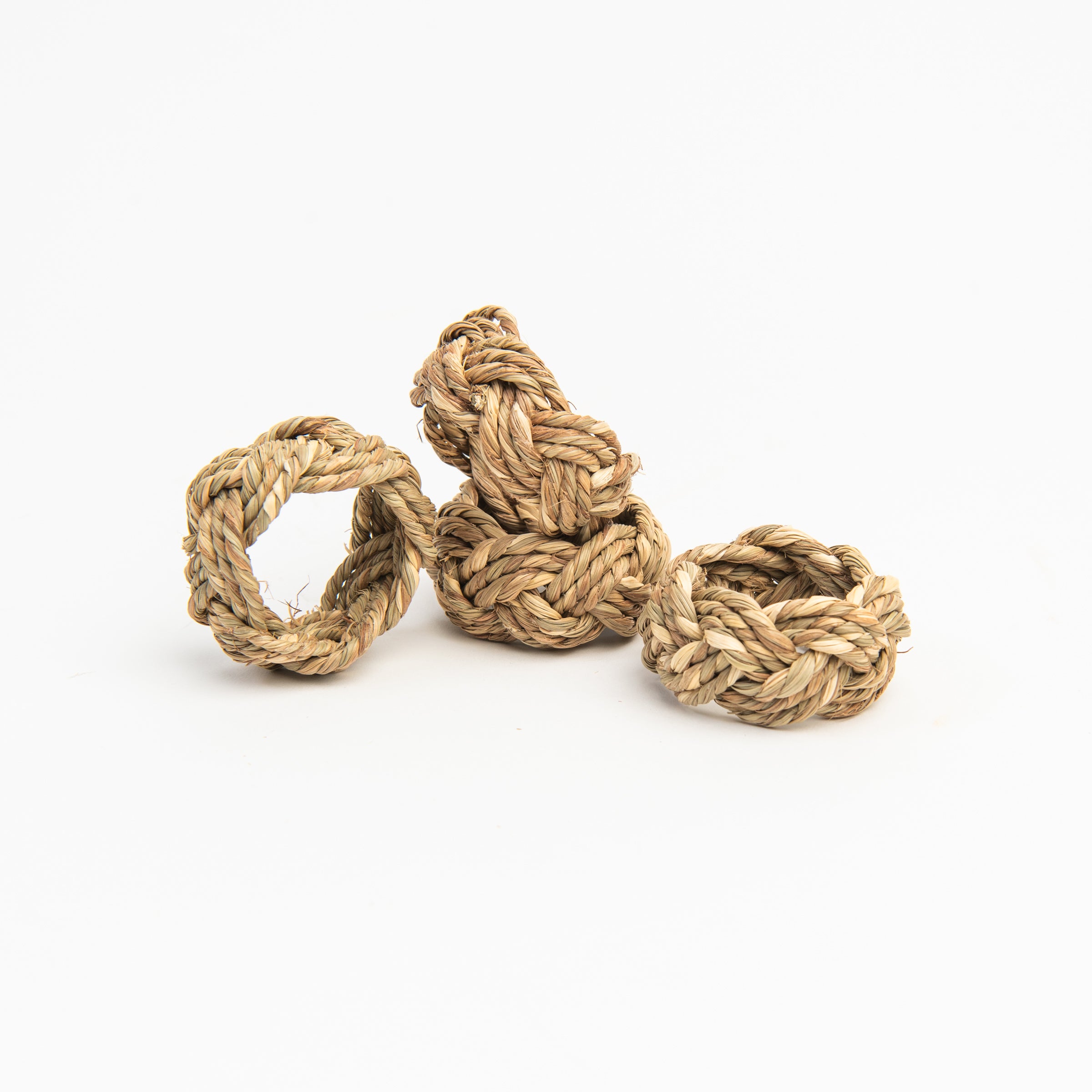 Braided Seagrass Napkin Rings on a white background at Addison West