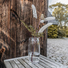 Addison Vase on a wood table outside at Addison West