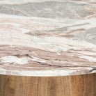Close up of Allyson Round Medium Brown w/ Pink Marble Pedestal Dining Table