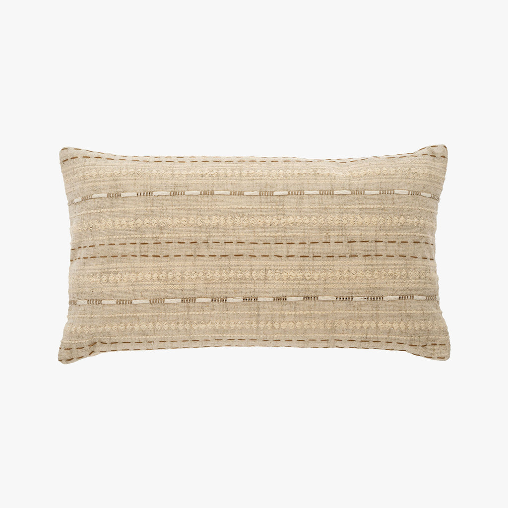 Natural colored 12 x 21 inch embroidered lumbar pillow with down insert on a white background