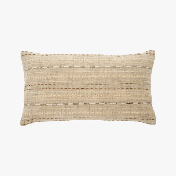 Natural colored 12 x 21 inch embroidered lumbar pillow with down insert on a white background