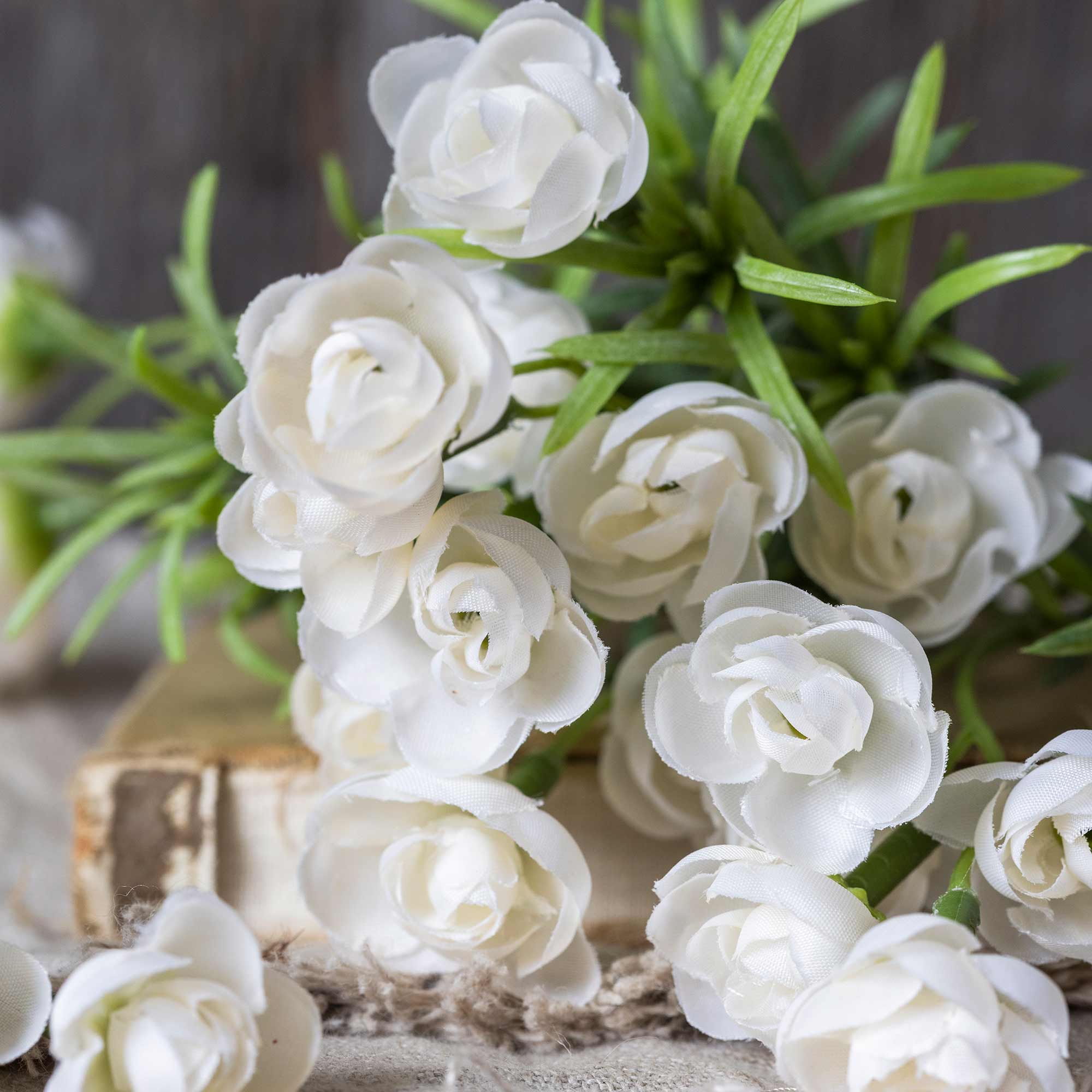 Closed up of Abigail Ahern Faux Hellebore Bunch in White on a table at Addison West