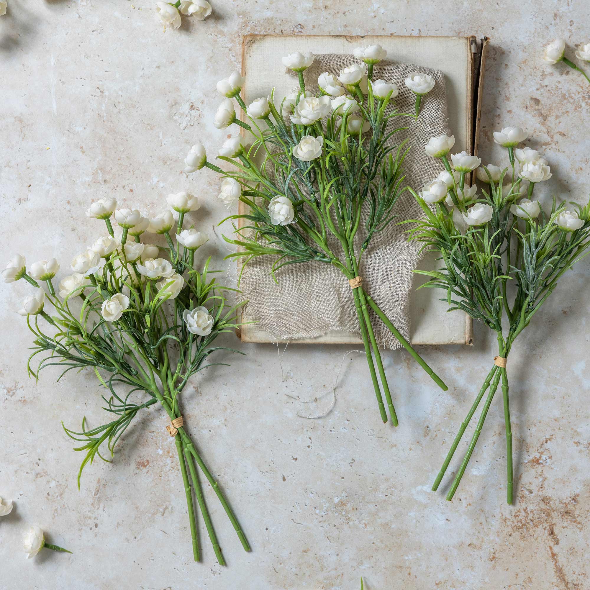 Abigail Ahern Faux Hellebore Bunch in White on a table at Addison West