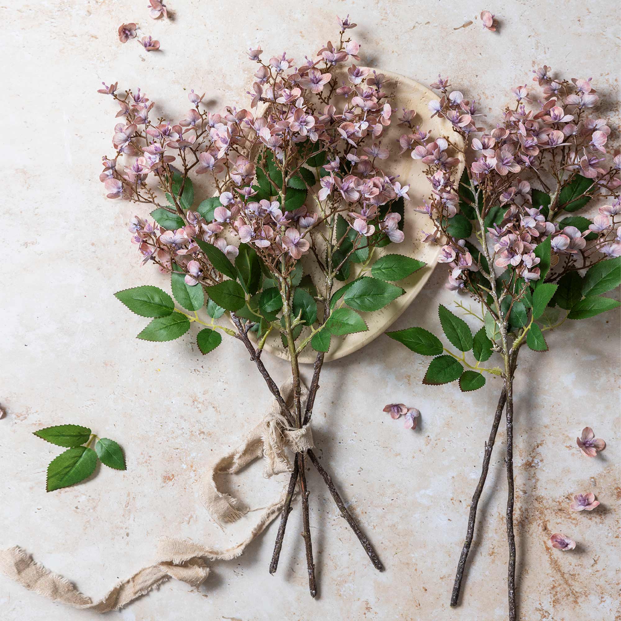 Abigail Ahern Faux Japanese Cherry in Blush in a vase on a beige background at Addison West