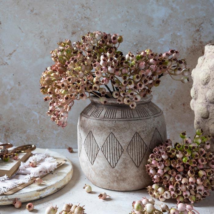 Abigail Ahern Faux Rosehip Bunch in Blush in a vase on a beige background at Addison West