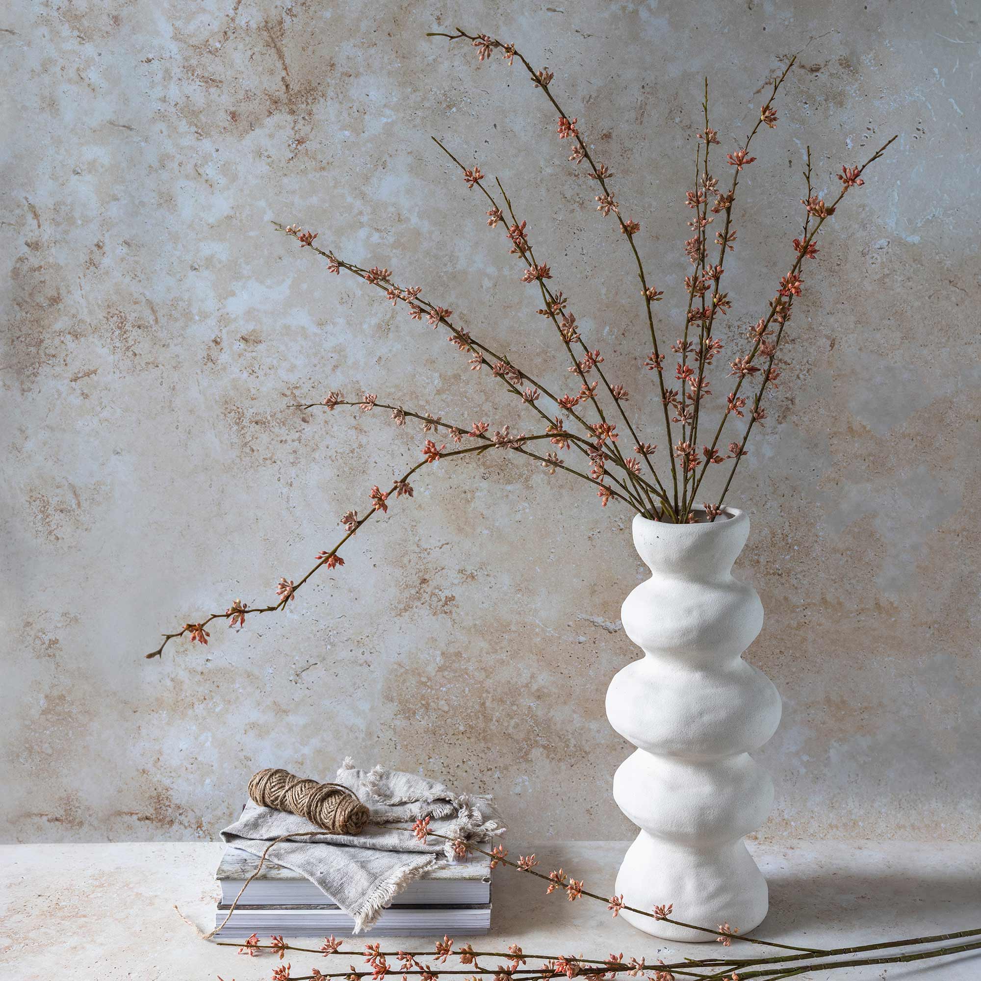 Abigail Ahern Faux Succulent Branch in Coral on a table at Addison West