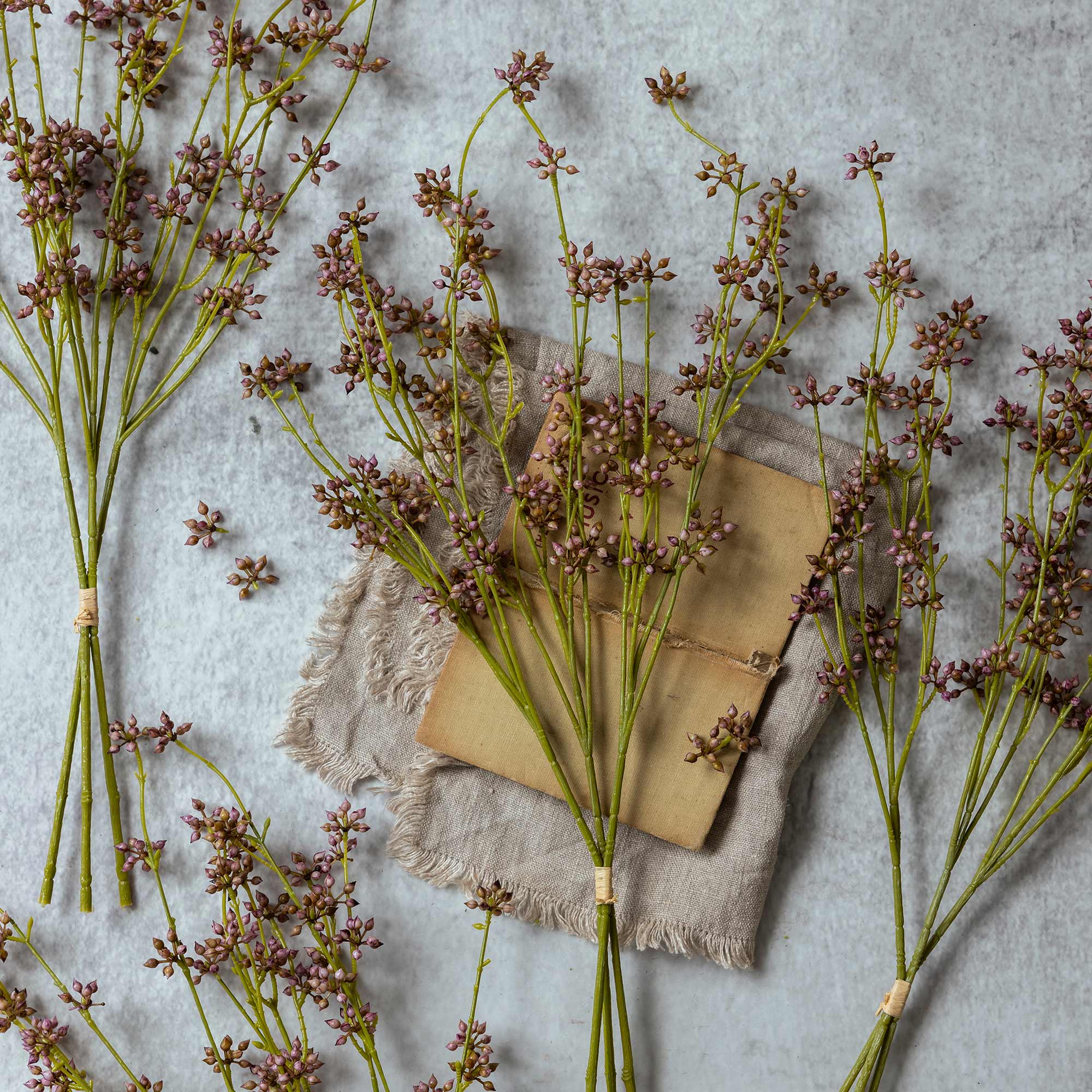 Abigail Ahern Faux Succulent Branch in Blush on a table at Addison West