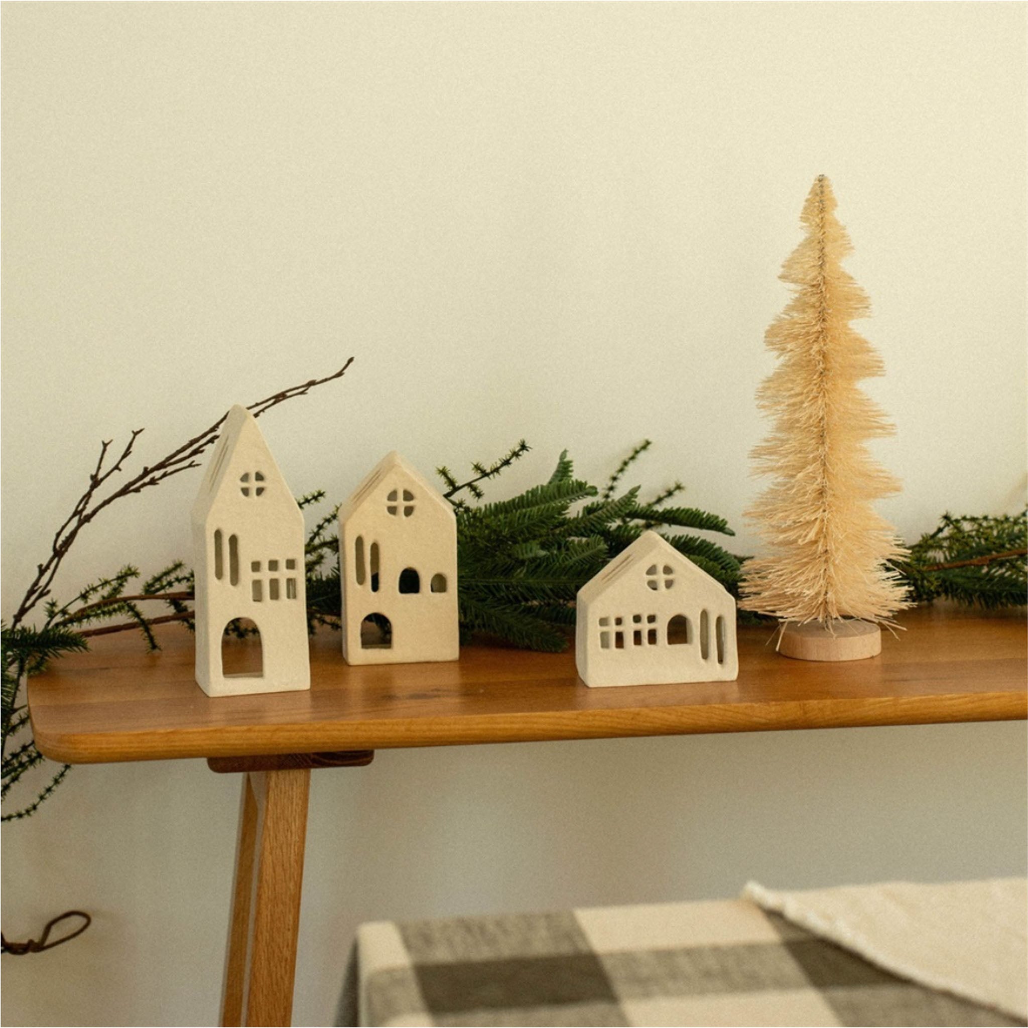 Aspen Tealight House on a wood table at Addison West