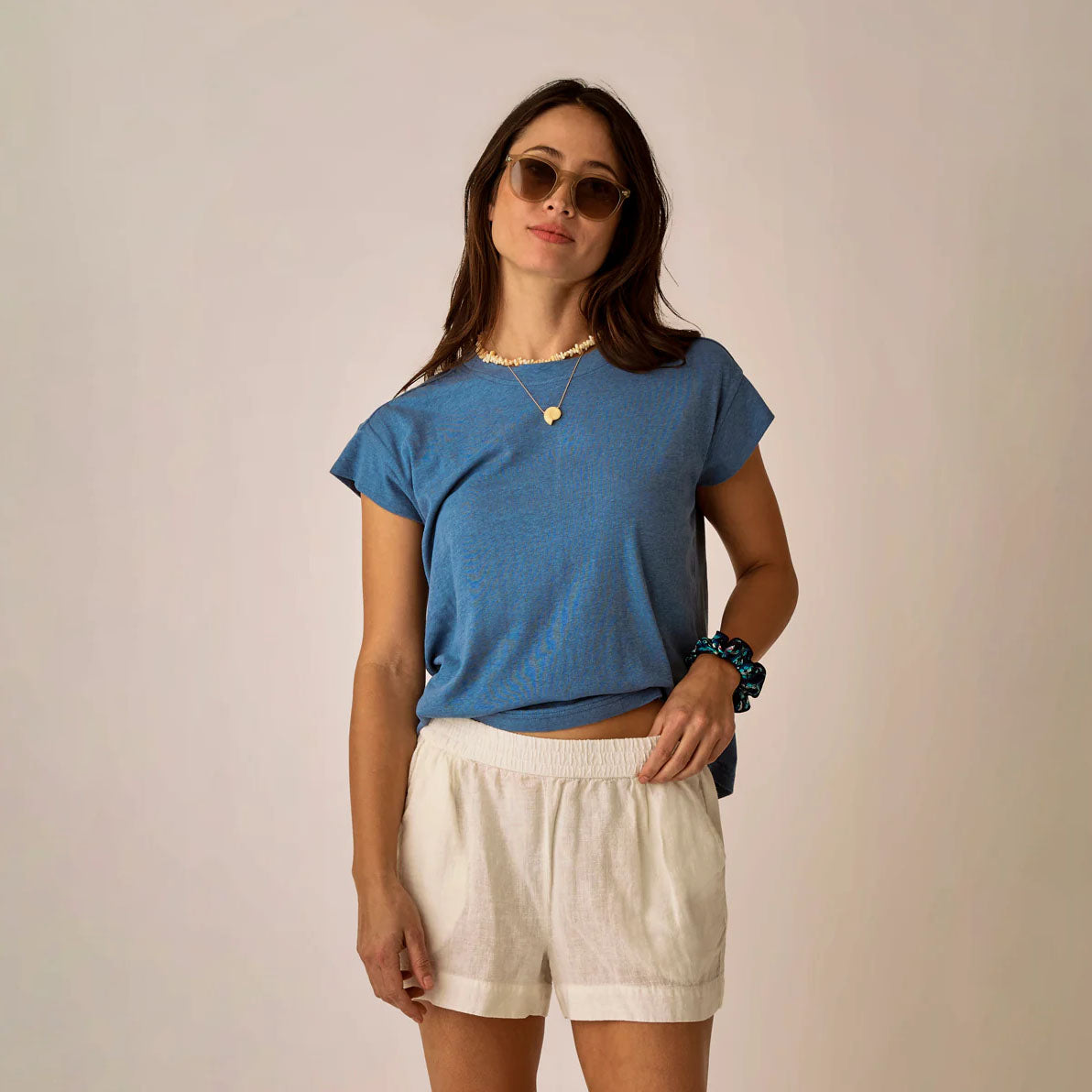 Astrid Hemp Tee in Captain shown on model on plain background.