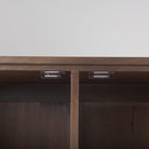 Close up of Astrid 36.0L x 17.0W x 70.0H Medium Brown Solid Wood Armoire on a white background