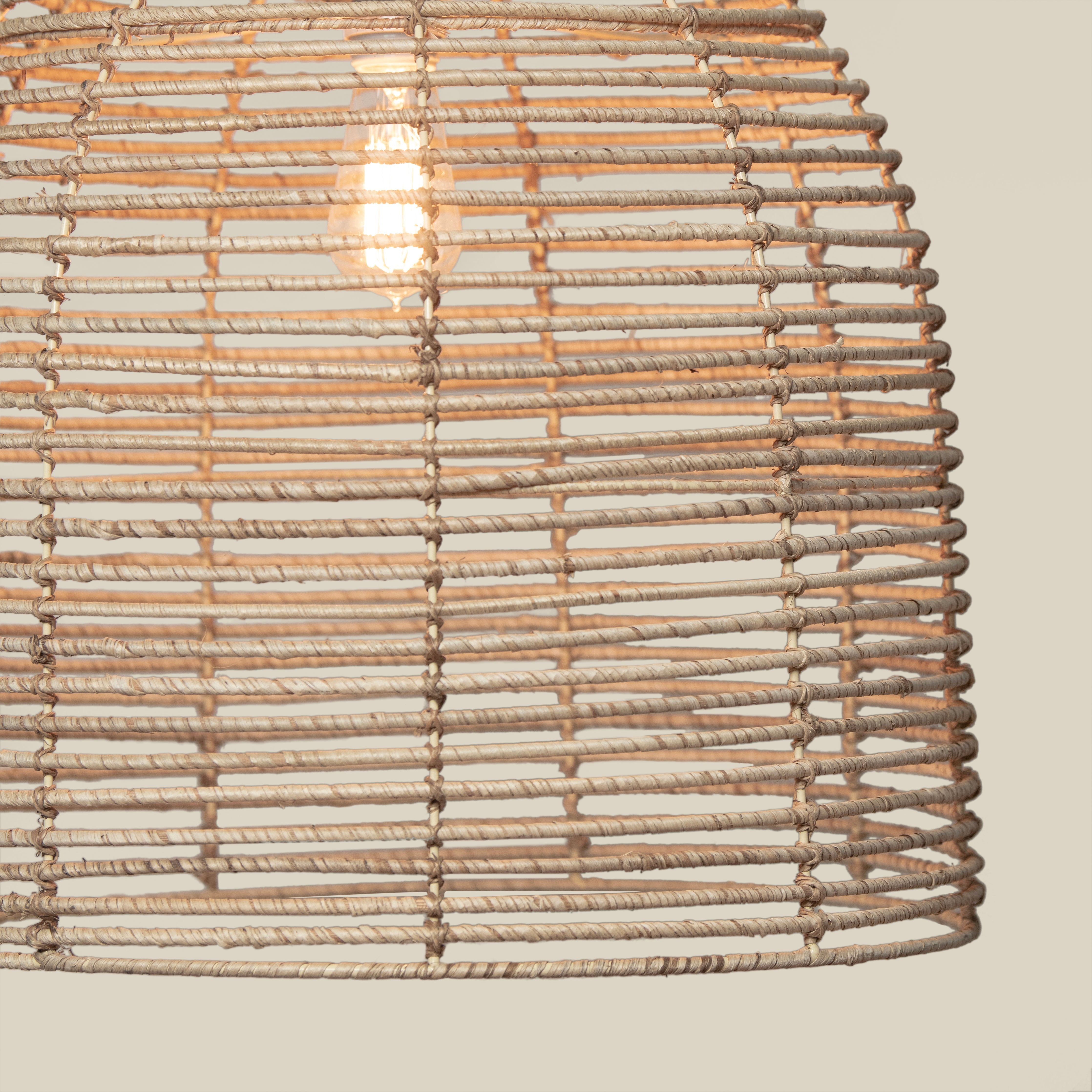 Close up of Beehive Chandelier on a beige background at Addison West