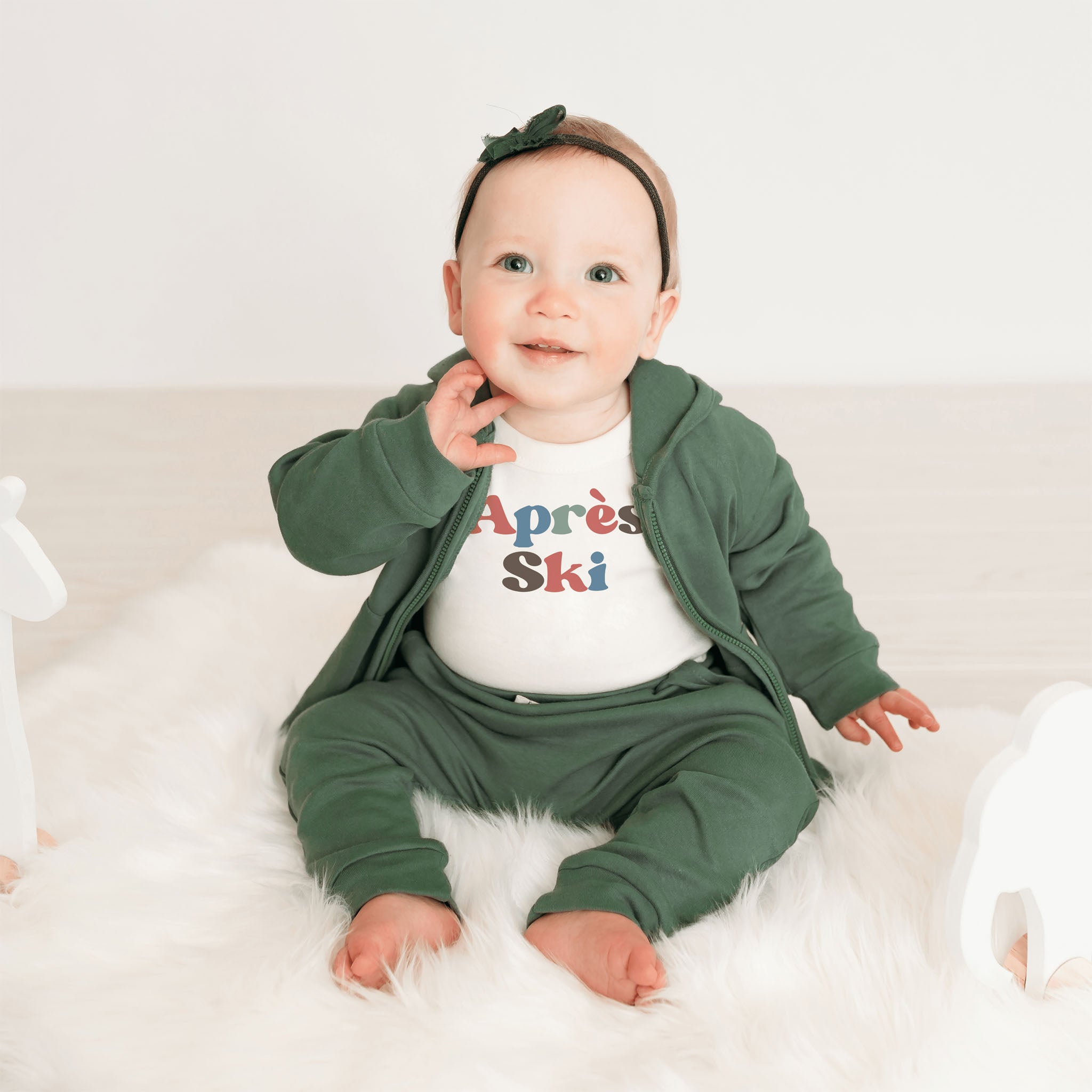 Apres Ski Baby Organic Cotton Bodysuit on a white background at Addison West