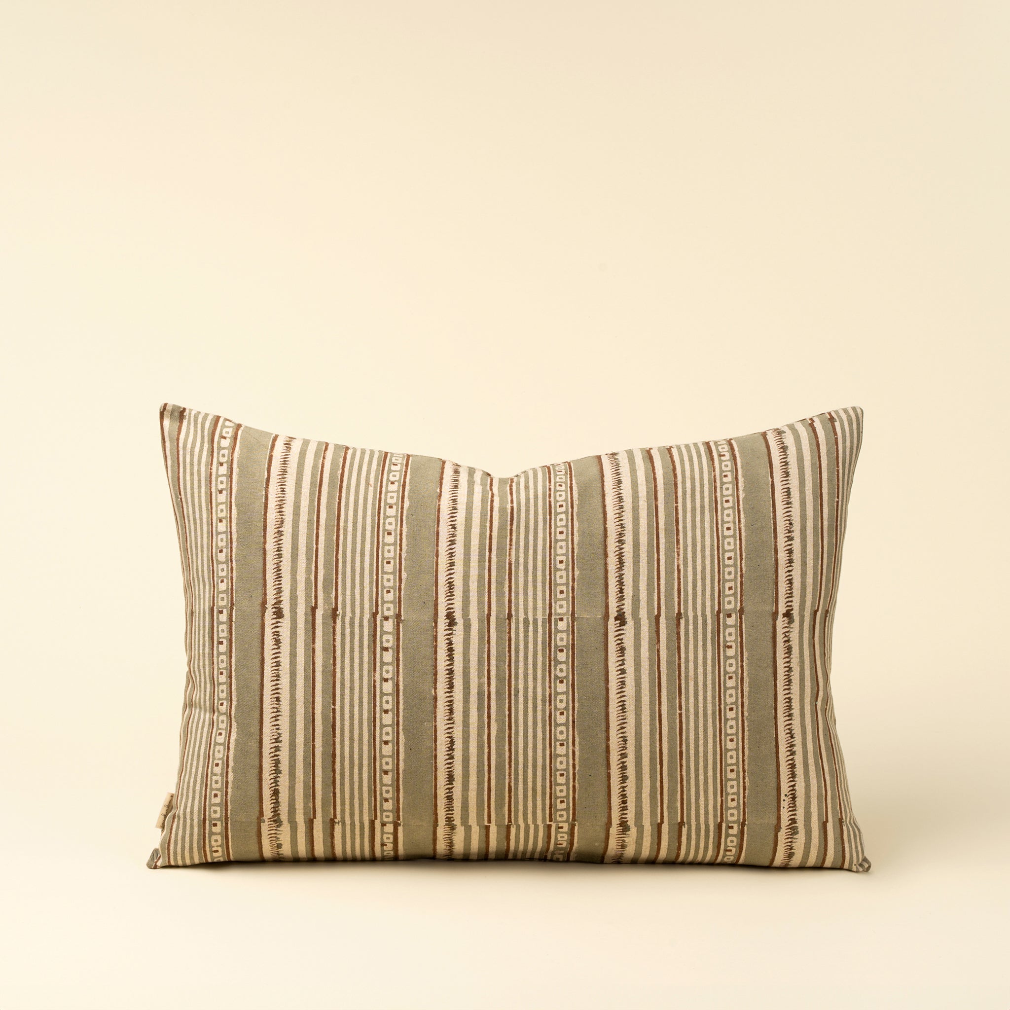 Haven Block Print 16" x 24" Lumbar Pillow on a beige background at Addison West