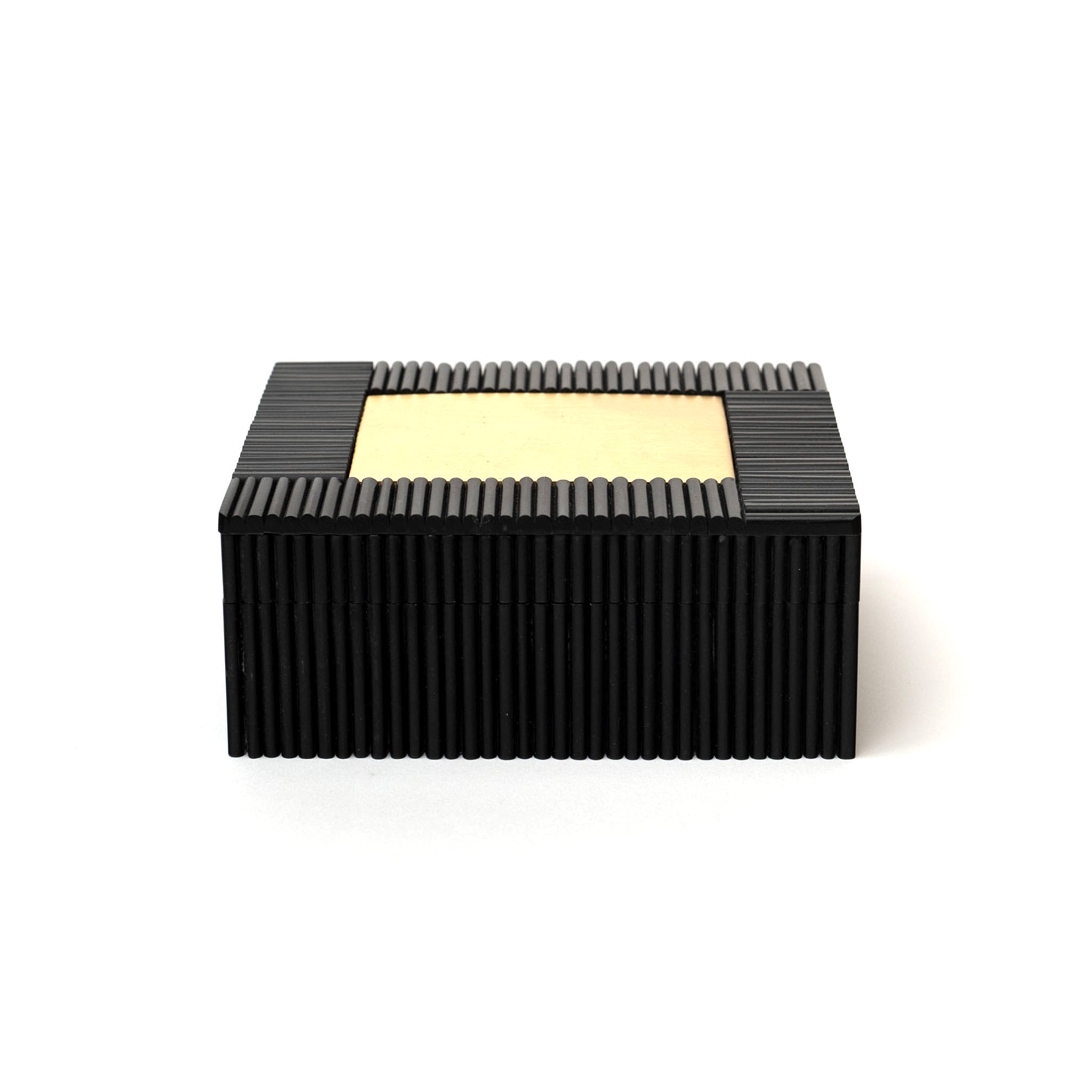 Black & Brass Box on a white background at Addison West