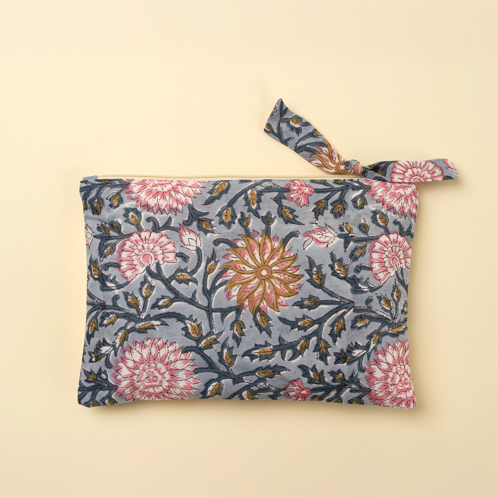 Block Print Pouch in Blue on a beige background at Addison West