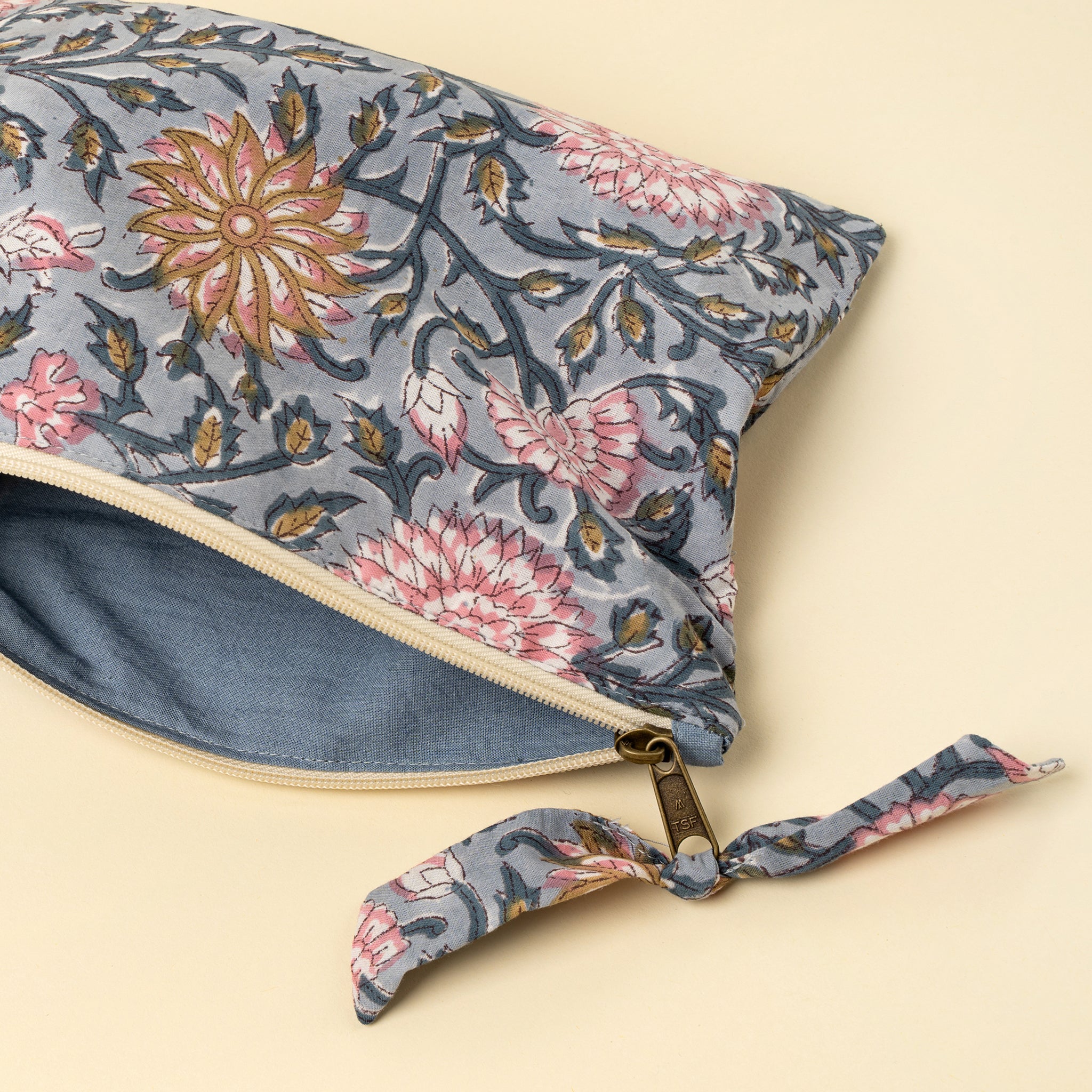 Block Print Pouch in Blue on a beige background at Addison West