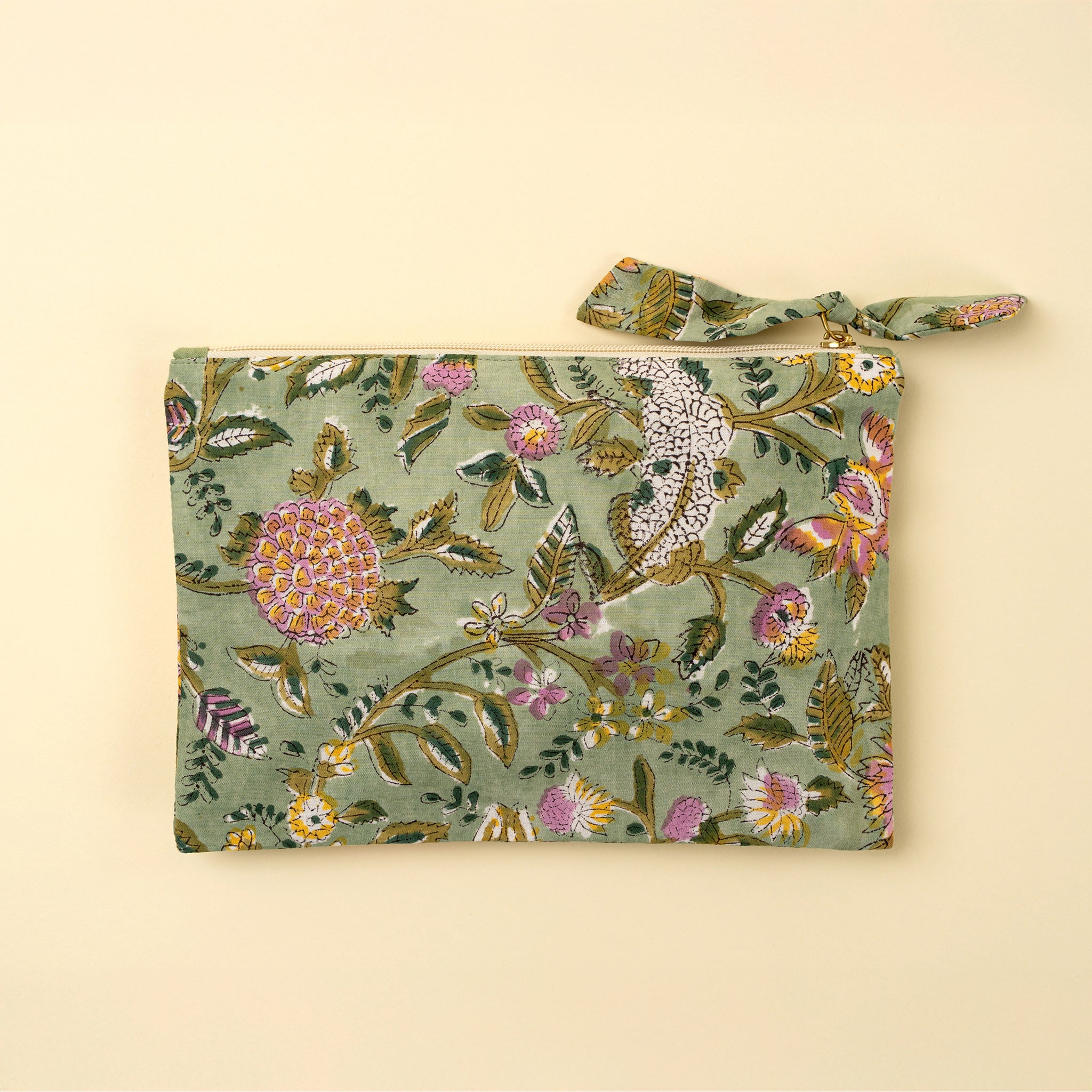 Block Print Pouch in Green on a beige background at Addison West