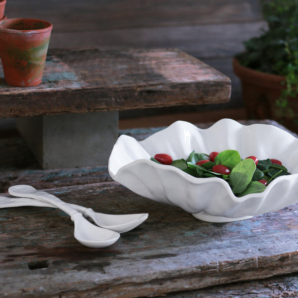 Beatriz Ball Bloom Large Bowl in white melamine on a wood bench
