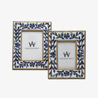 Two picture frames with floral bone navy blue inlay on a white background
