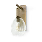 Kirk Nix Bronson Sconce In Brass on a white background at Addison West