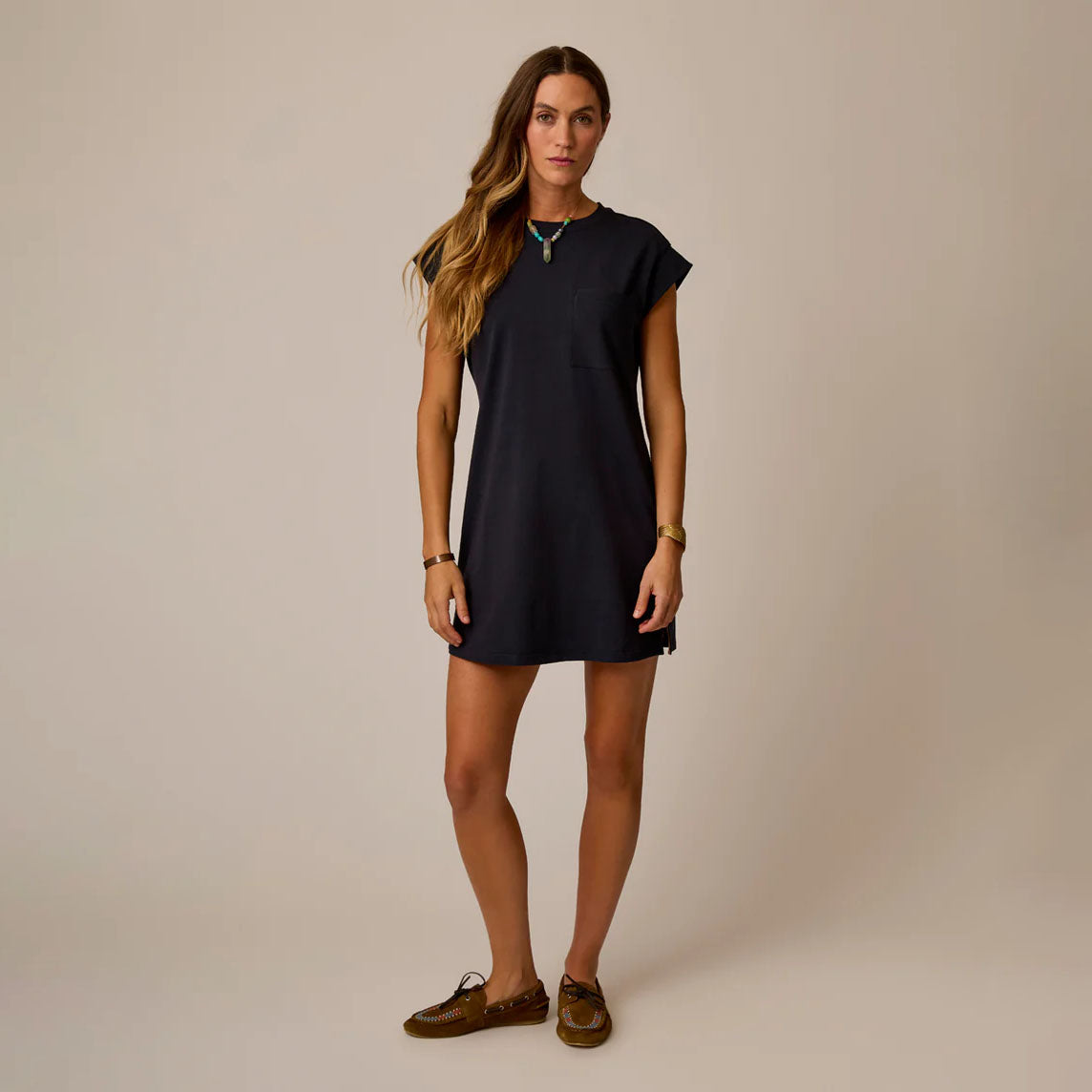 Cosmo Dress in Black shown on model on plain background.