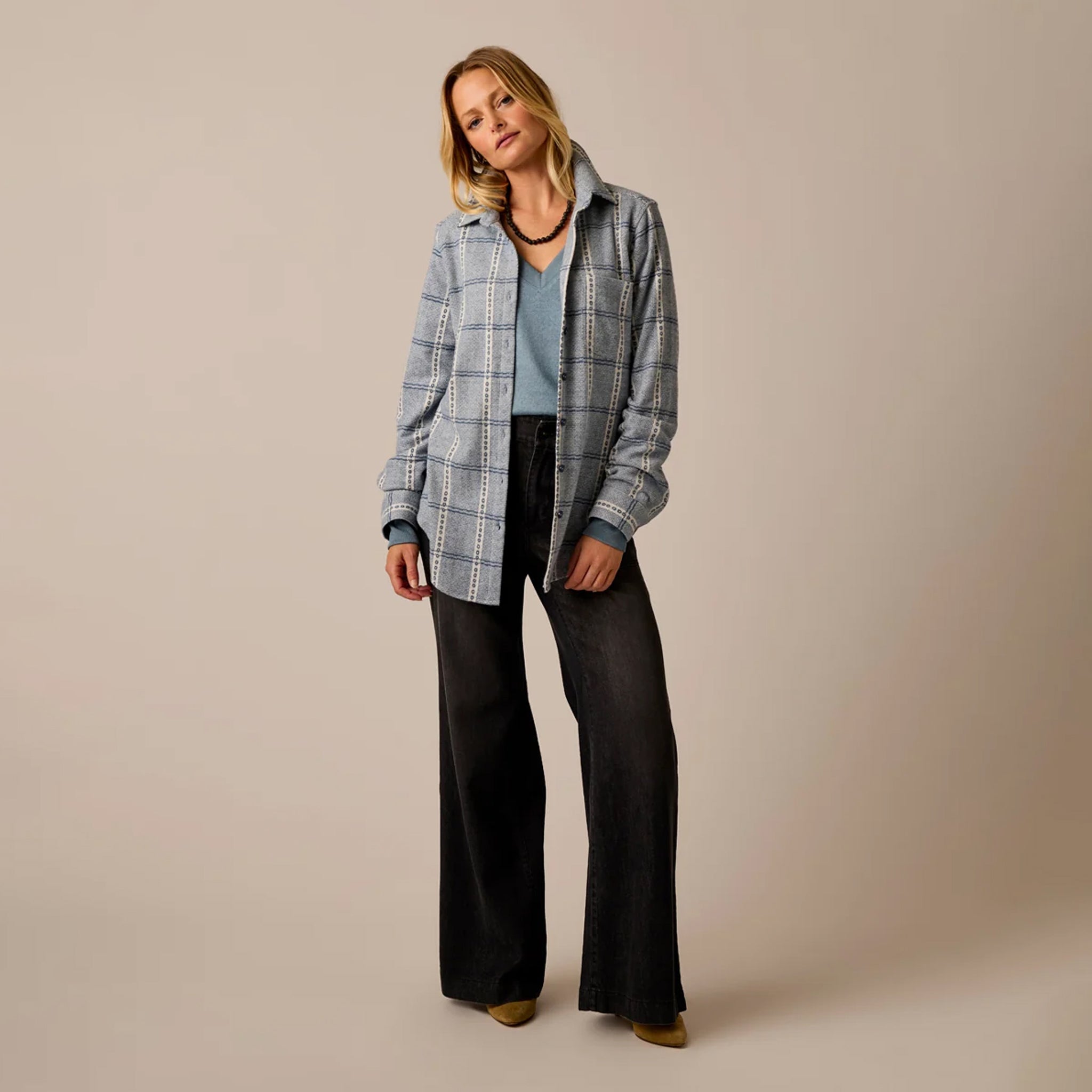 Female model shown wearing the Carve Fairbanks Supersoft Shirt in Blue Mirage Dobby Plaid on plain background.