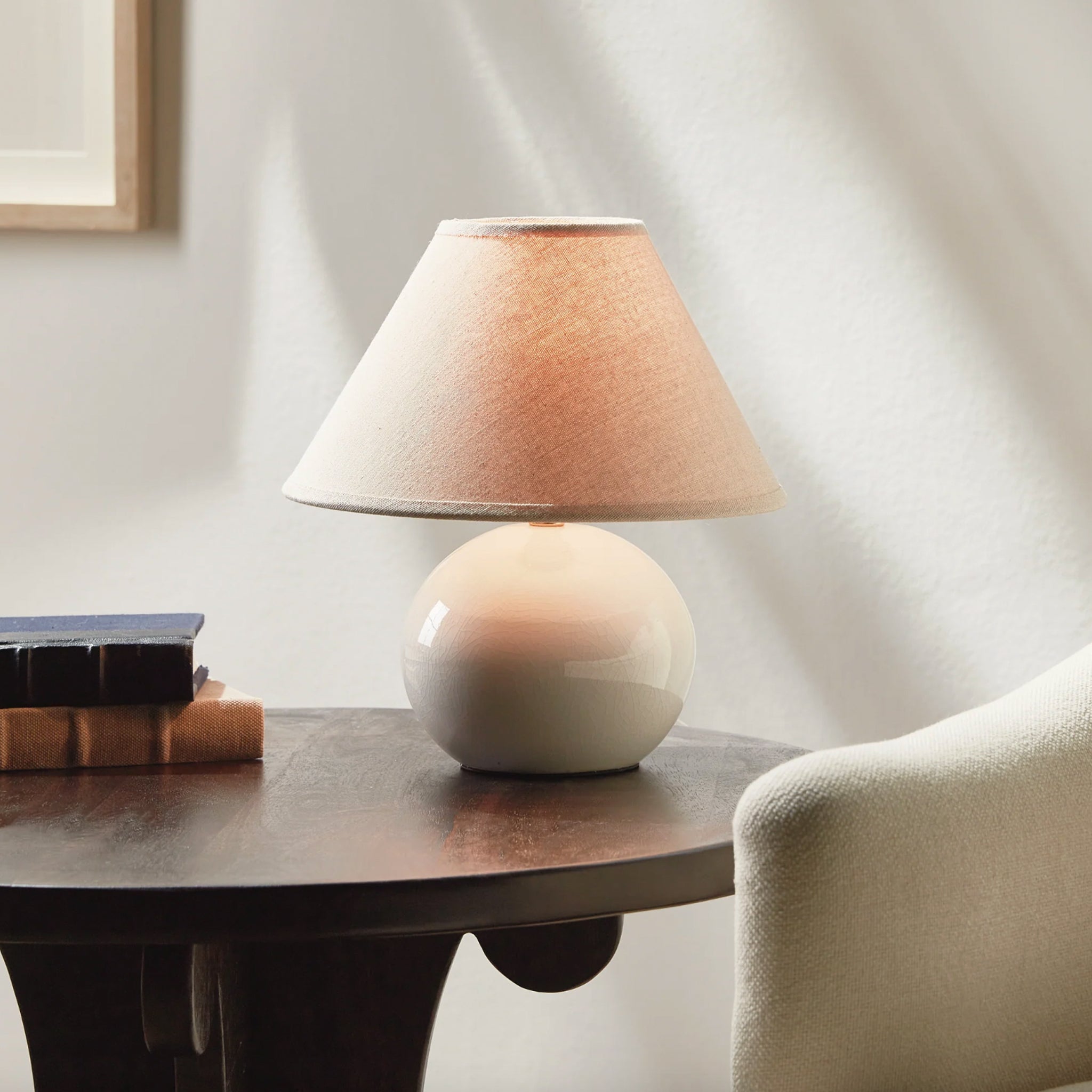 Charlie Mini Lamp in White on a table at Addison West