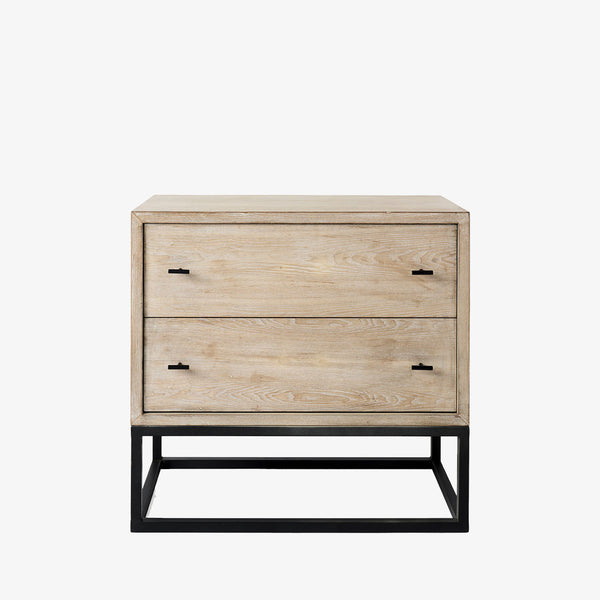 Cabinet with two drawers in white washed wood and black metal base on a white background