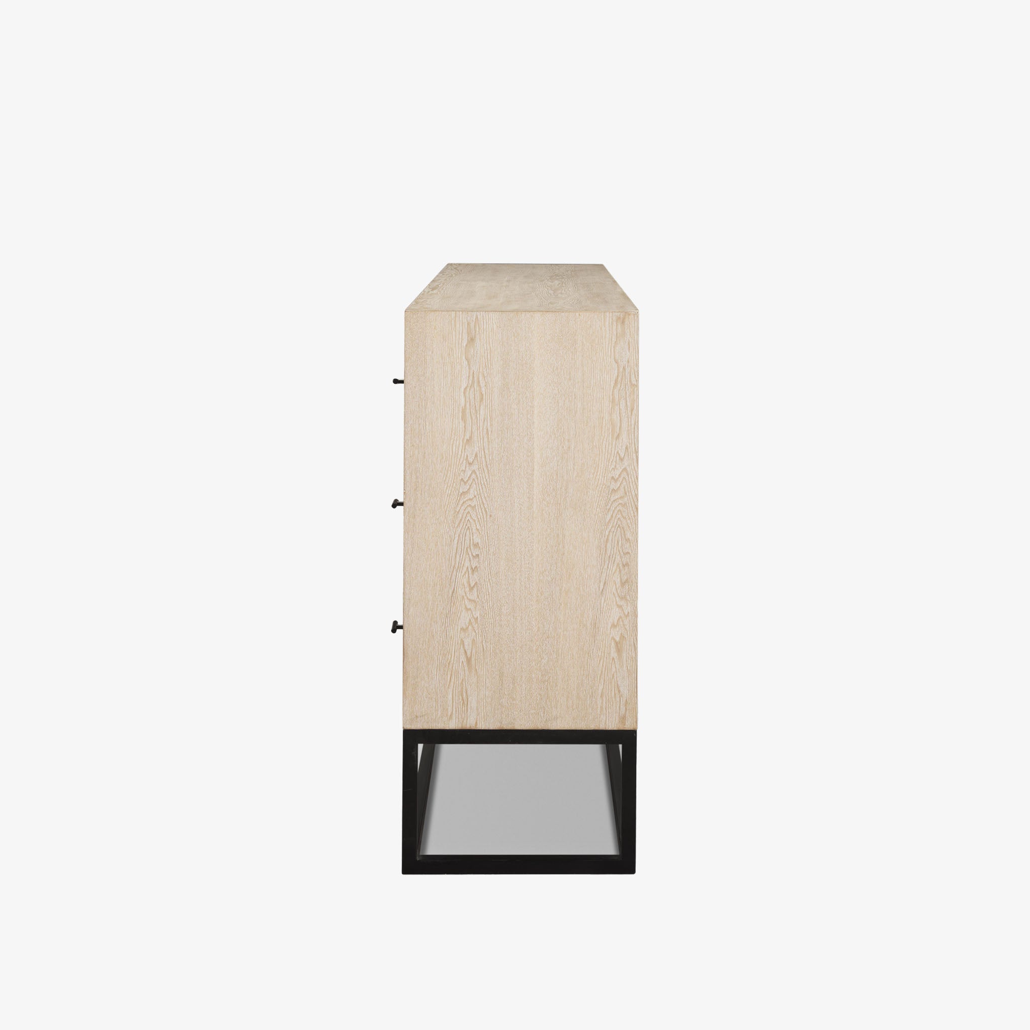 White washed wood six drawer dresser with metal base on a white background