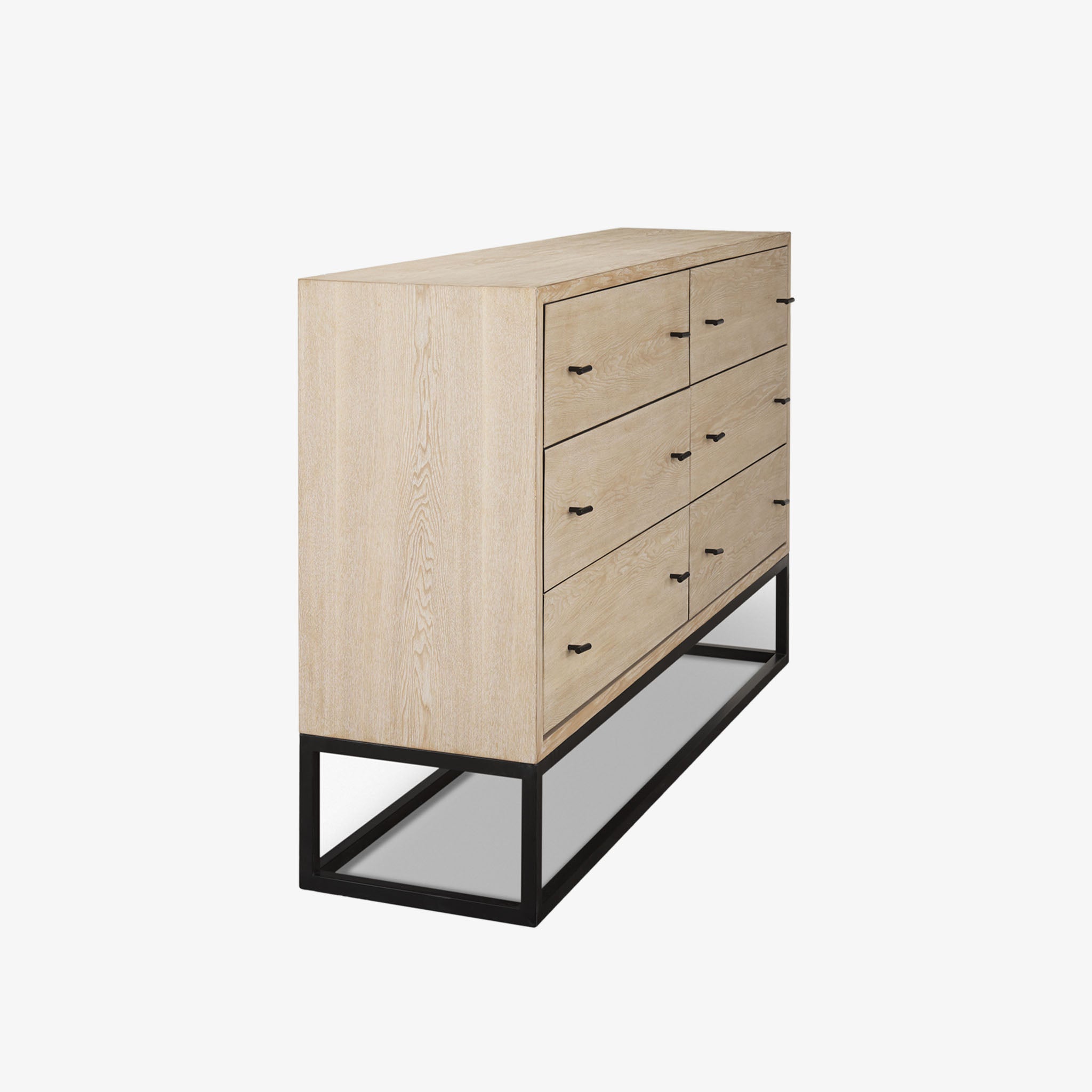 White washed wood six drawer dresser with metal base on a white background