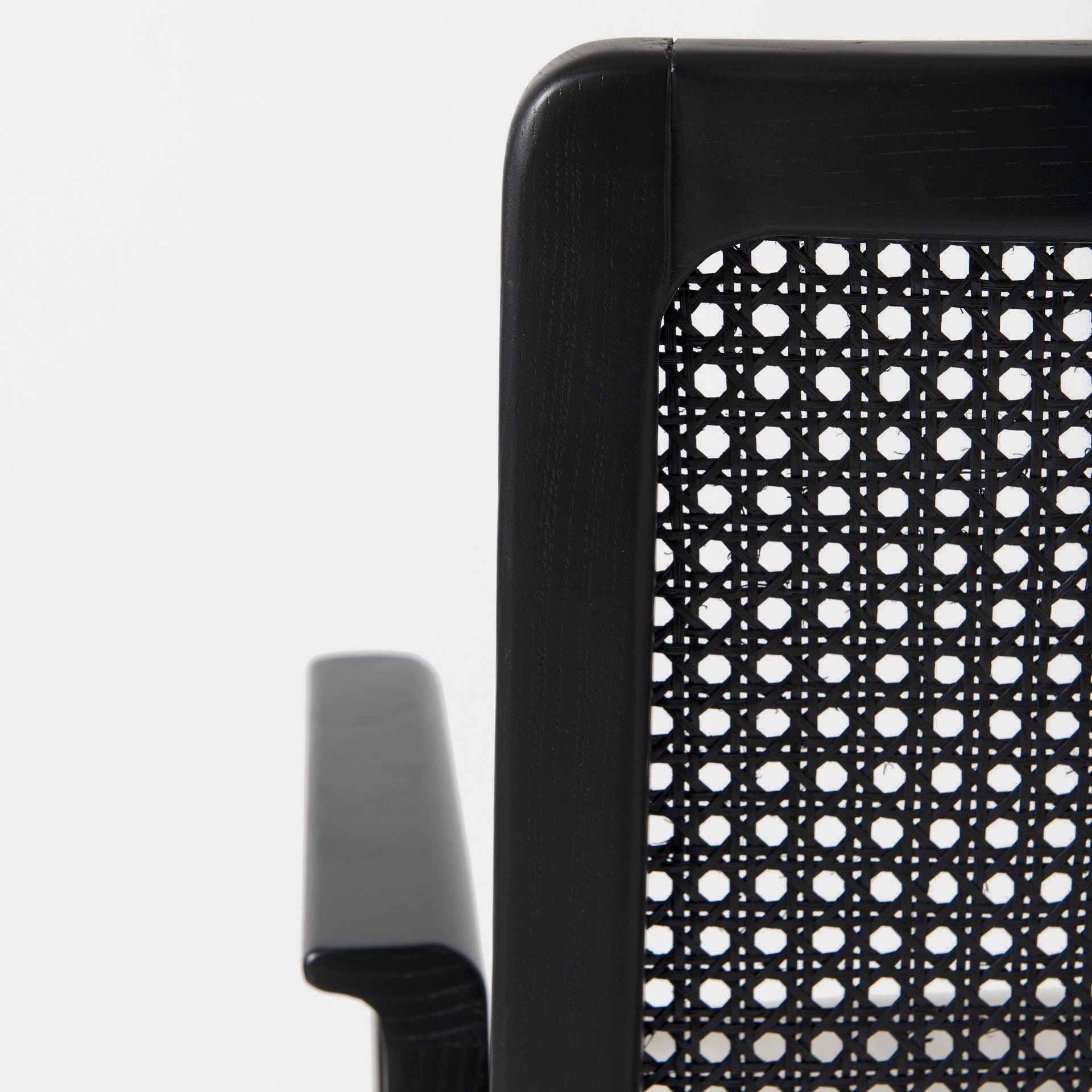 Clara Black Wood W/ Cream Fabric Seat and Cane Back Dining Chair on a white background