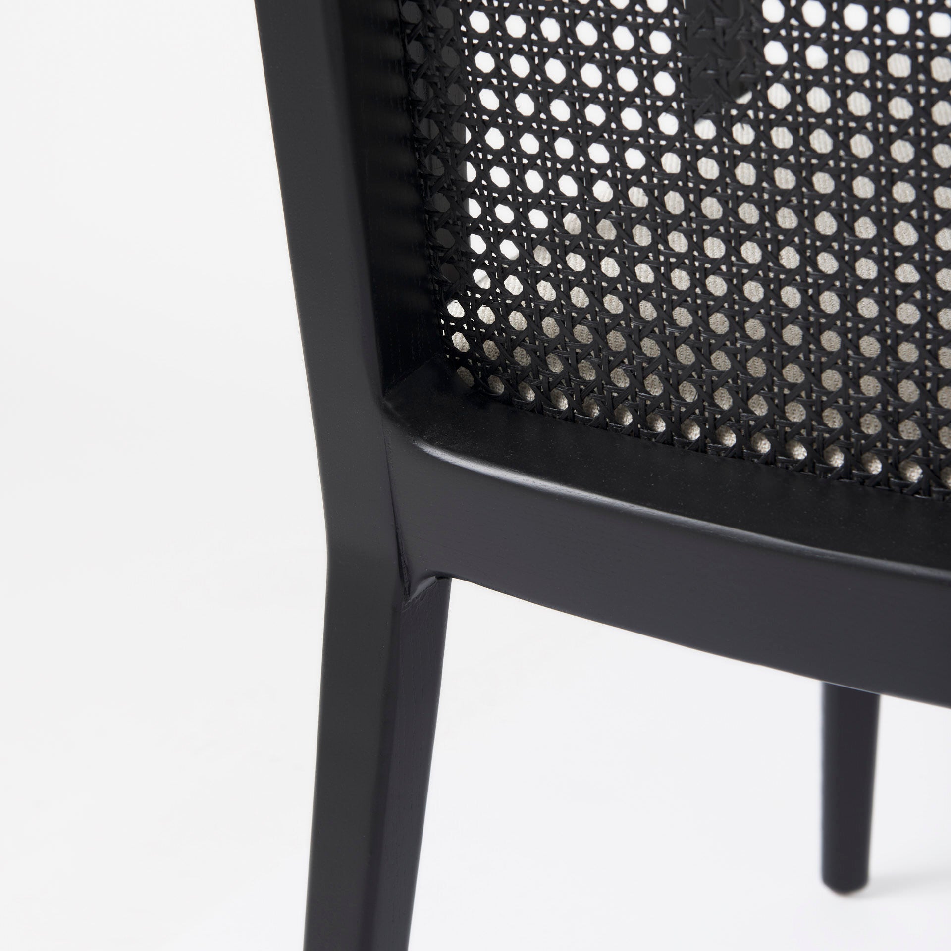 Clara Black Wood W/ Cream Fabric Seat and Cane Back Dining Chair on a white background