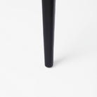 Close up of Clara Black Wood W/ Cream Fabric Seat and Cane Back Dining Chair on a white background