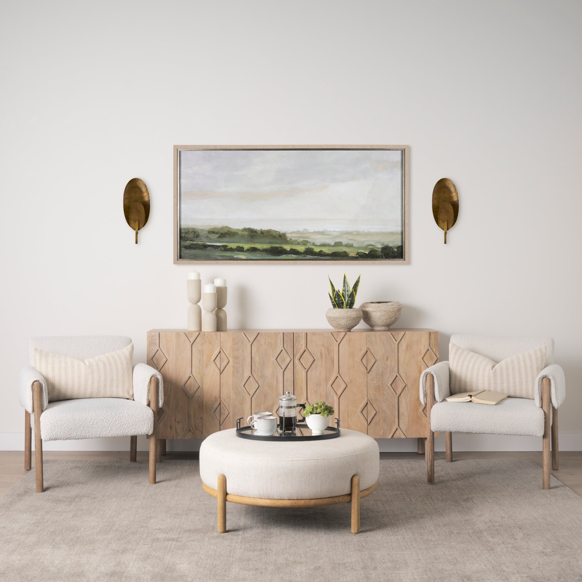 Clarence 7.0L x 5.3W x 17.0H Metal Hammered Gold Round Wall Sconce in a modern farmhouse living room