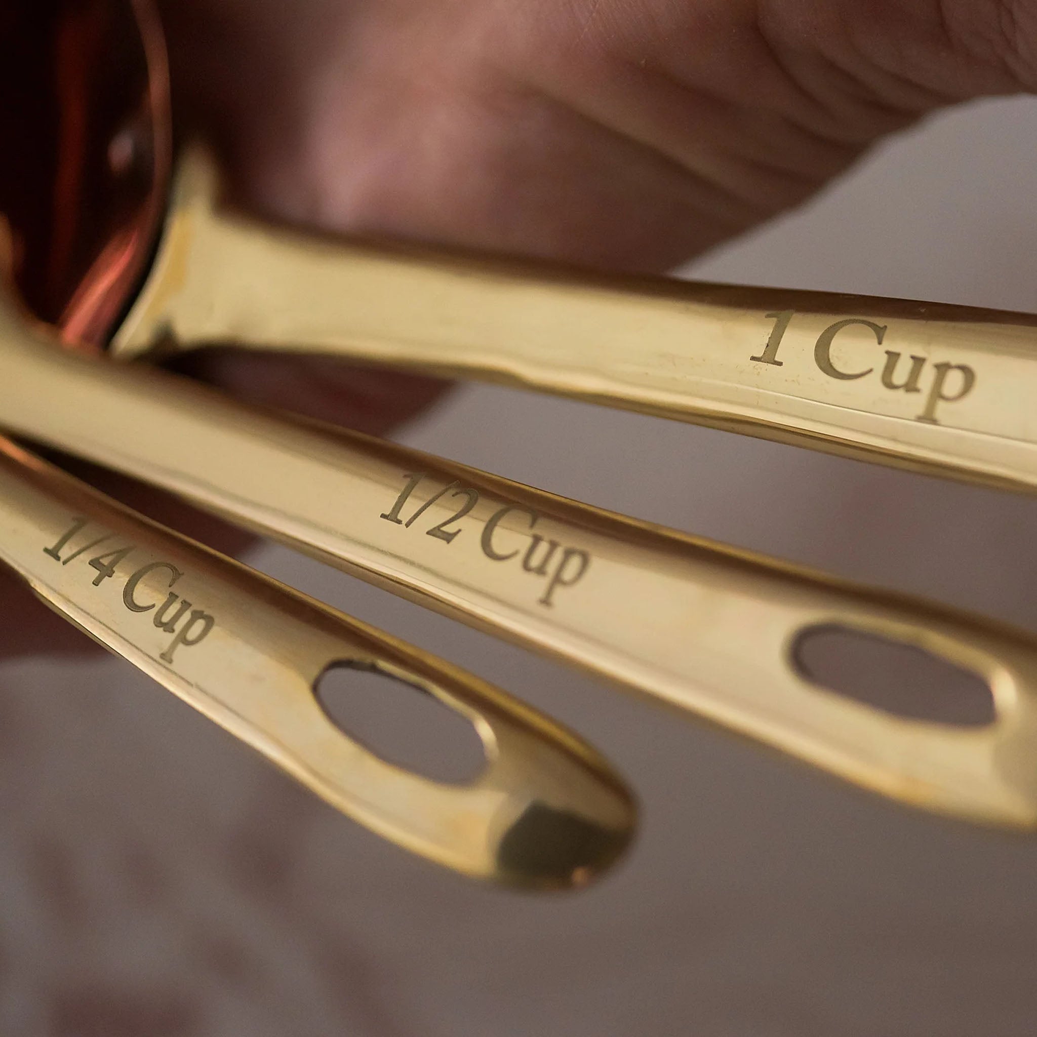 Copper Measuring Scoops on a table at Addison West