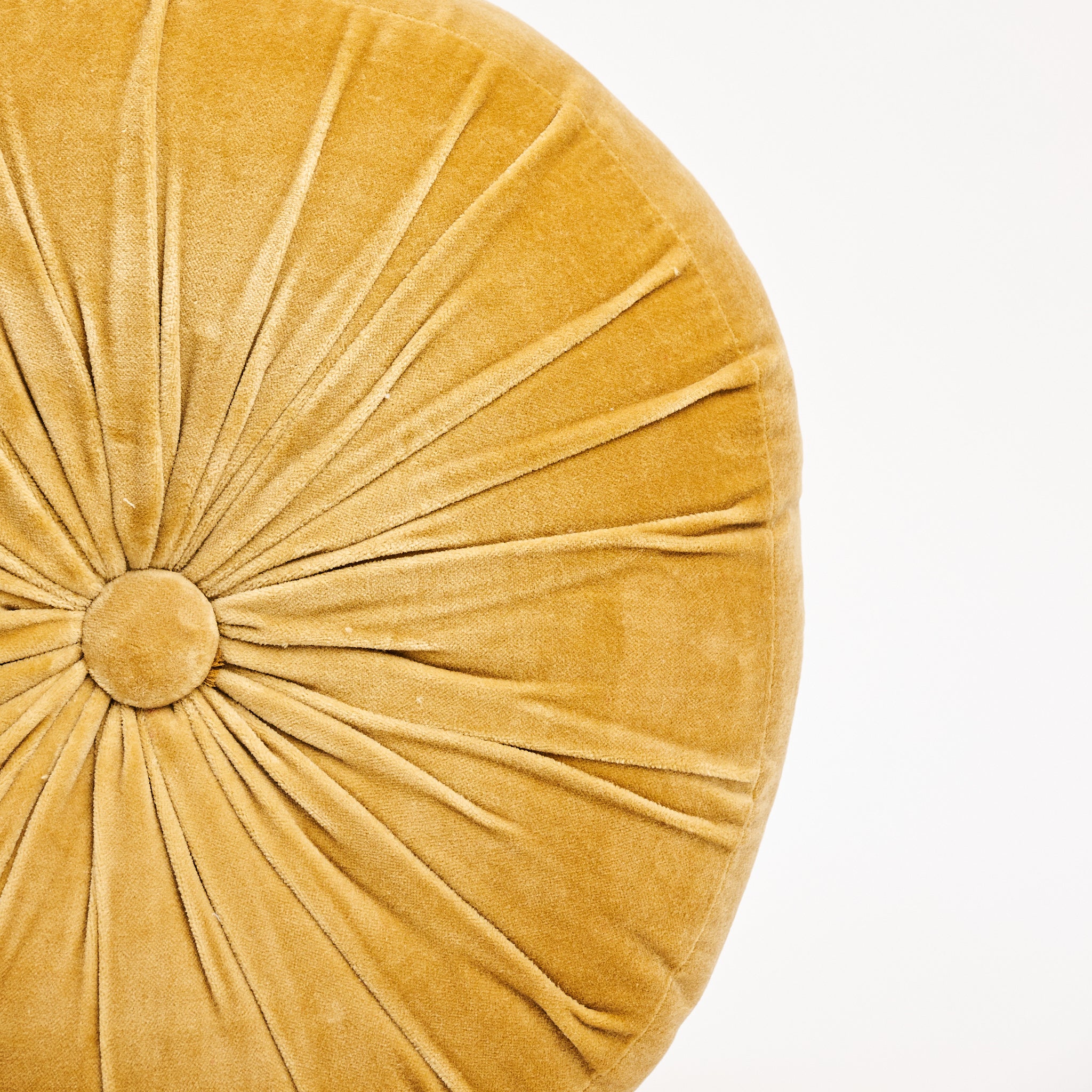 Velvet Tuft Round Cushion in Gold on a white background at Addison West