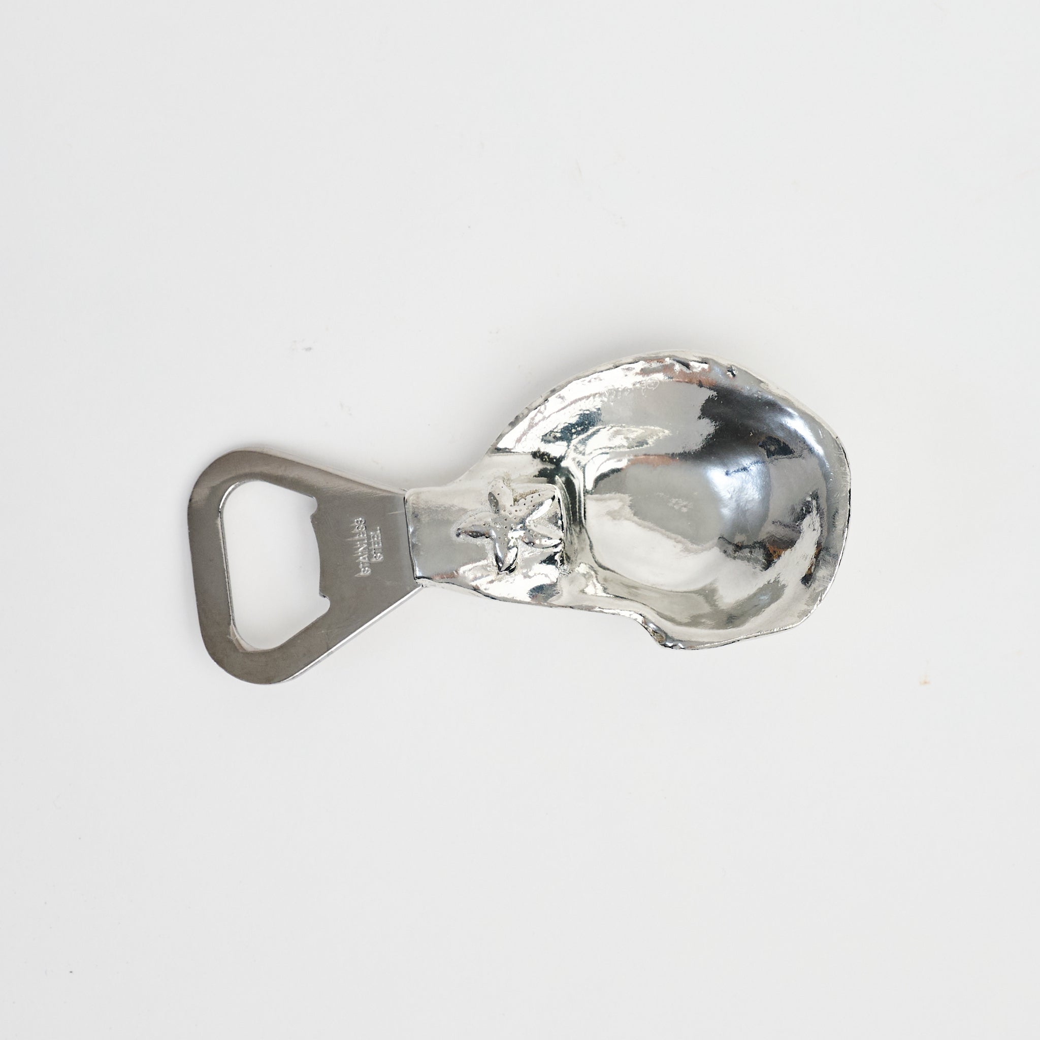 Oyster Shell Bottle Opener on a white background at Addison West