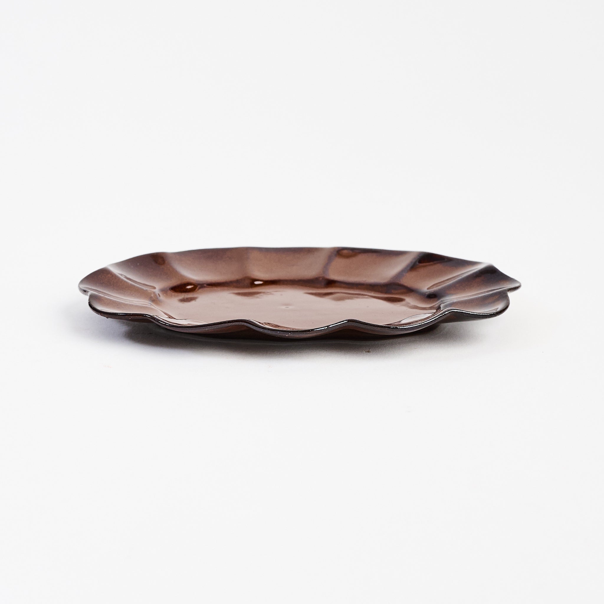 Stoneware Scalloped Oval Plate on a white background at Addison West