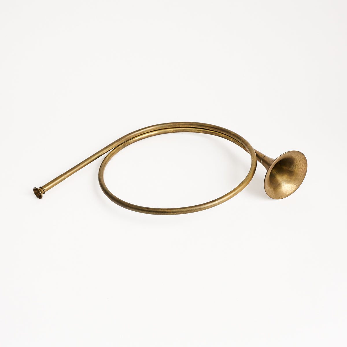 Vintage Brass French Horn on a white background at Addison West