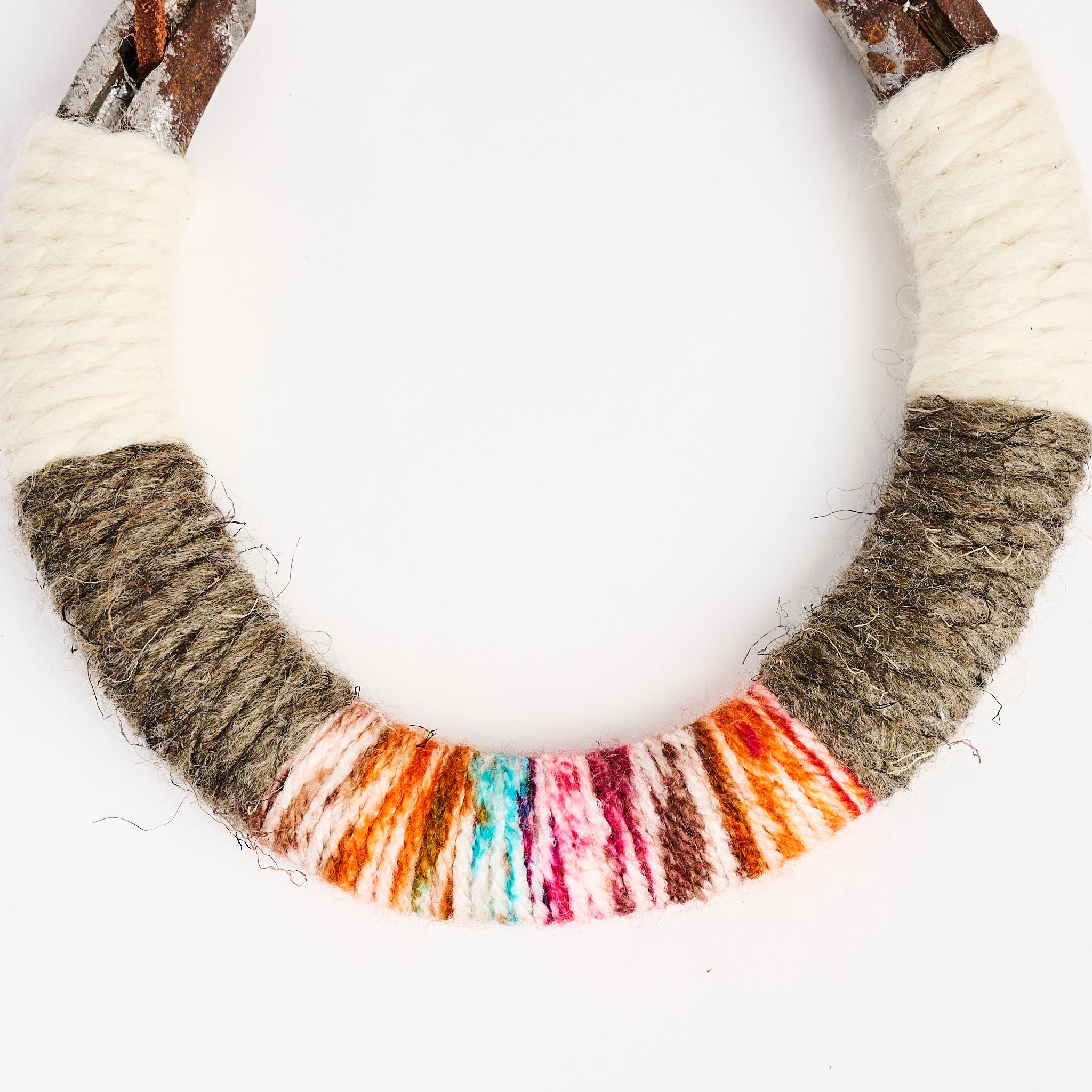 Upcycled Lucky Horseshoe in Rainbow on a white background at Addison West
