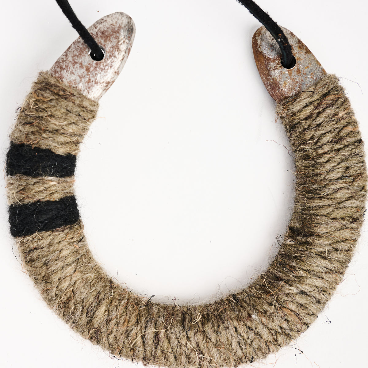 Upcycled Lucky Horseshoe in Neutral Stripes on a white background at Addison West