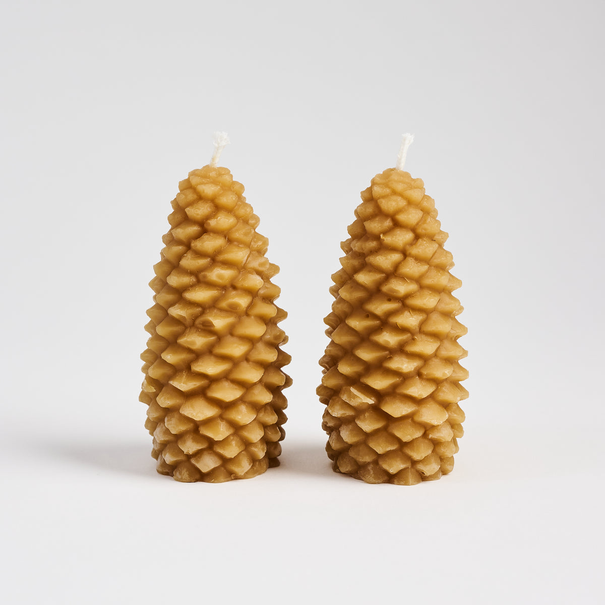Pinecone Beeswax Candle in Natural on a white background at Addison West