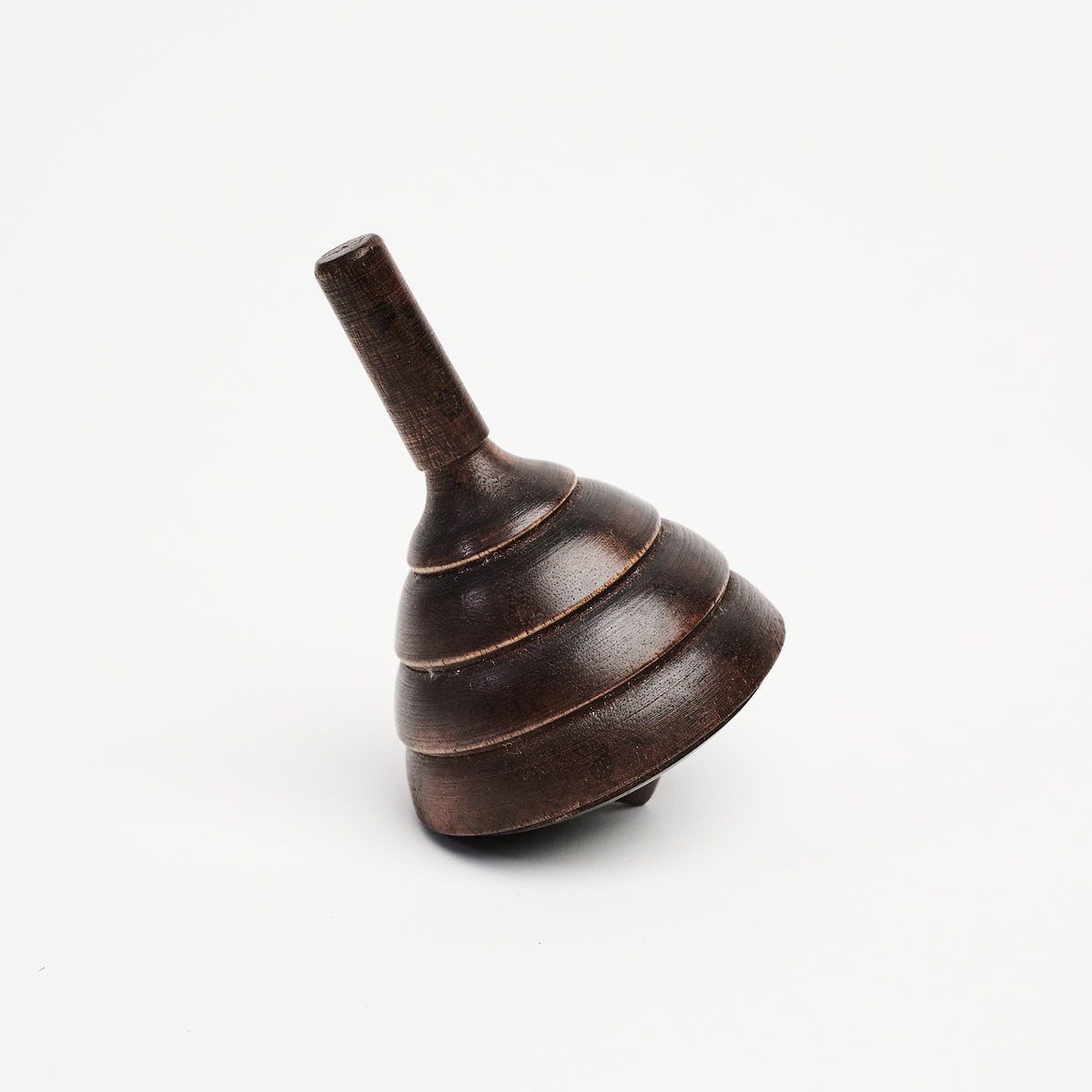 Spinning Wood Top on a white background at Addison West