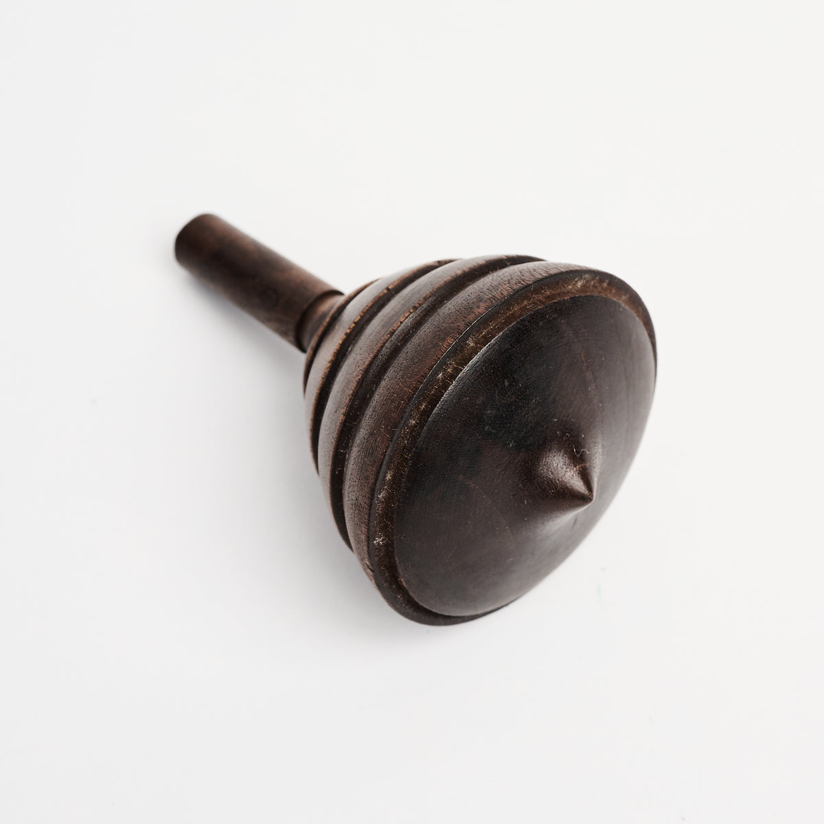 Spinning Wood Top on a white background at Addison West